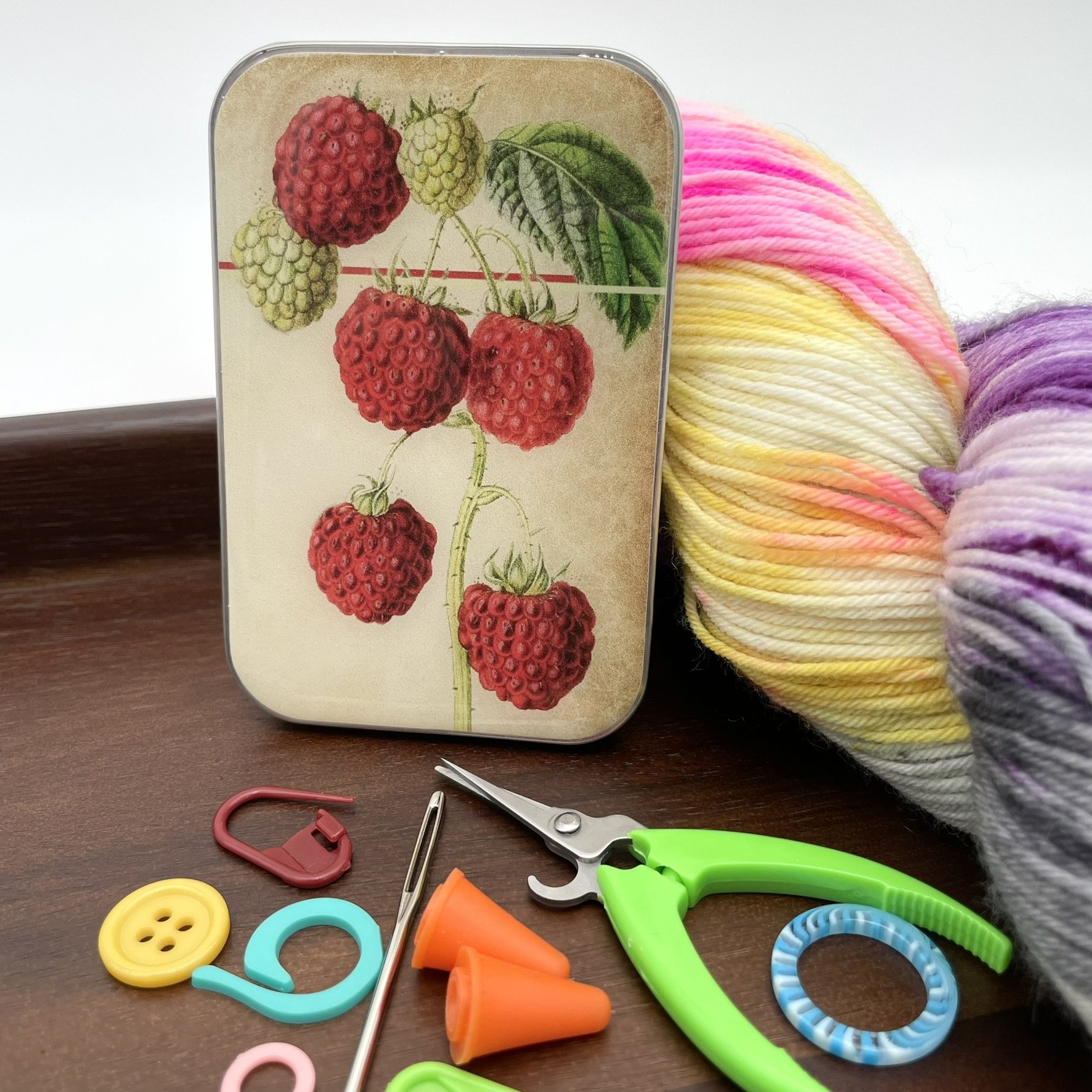 Firefly Notes notions tin with vintage raspberry design, upright view.