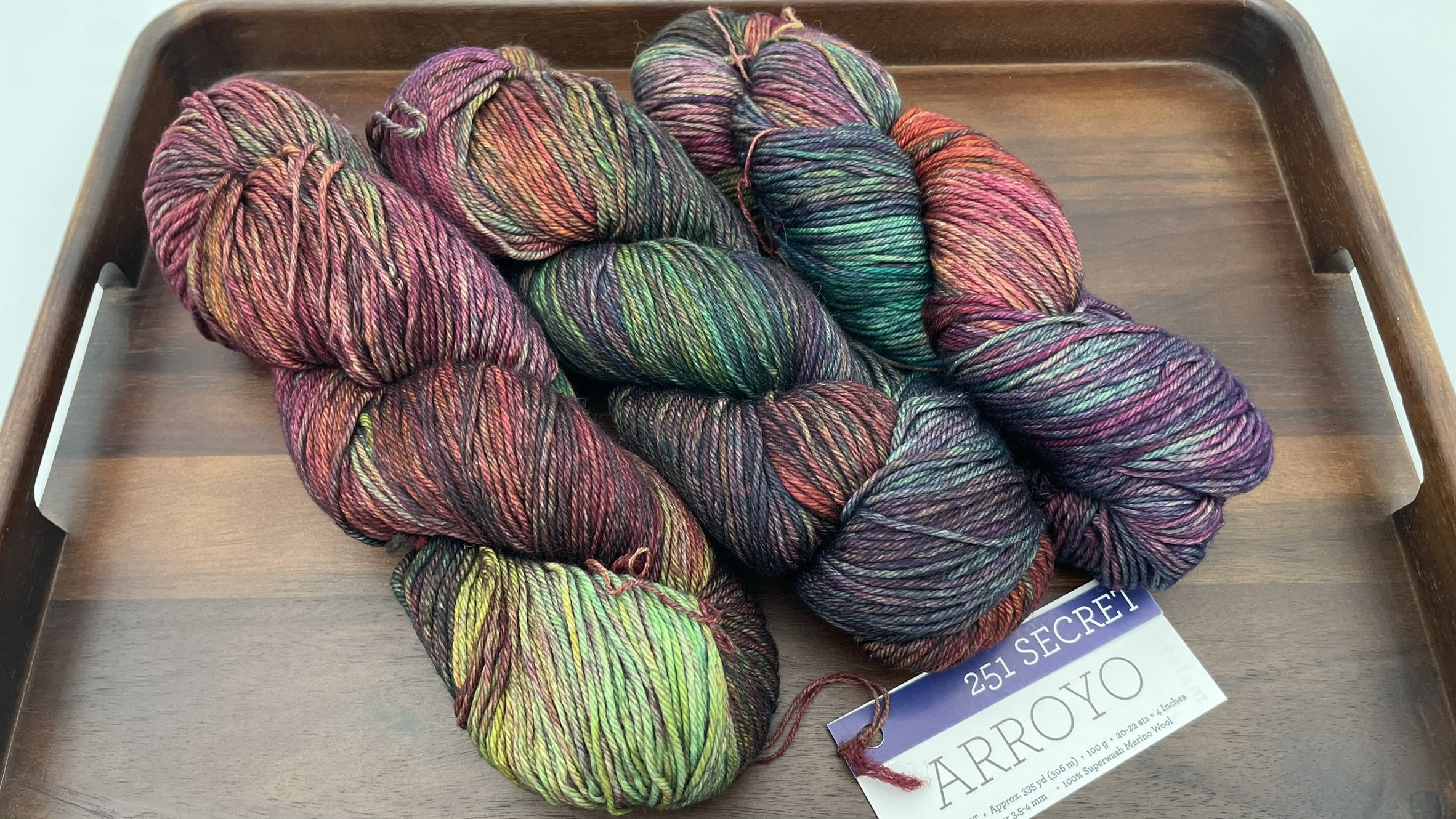 Malabrigo Arroyo yarn in the Secret colorway, shown in DK/Sport weight for knitting and crochet projects.