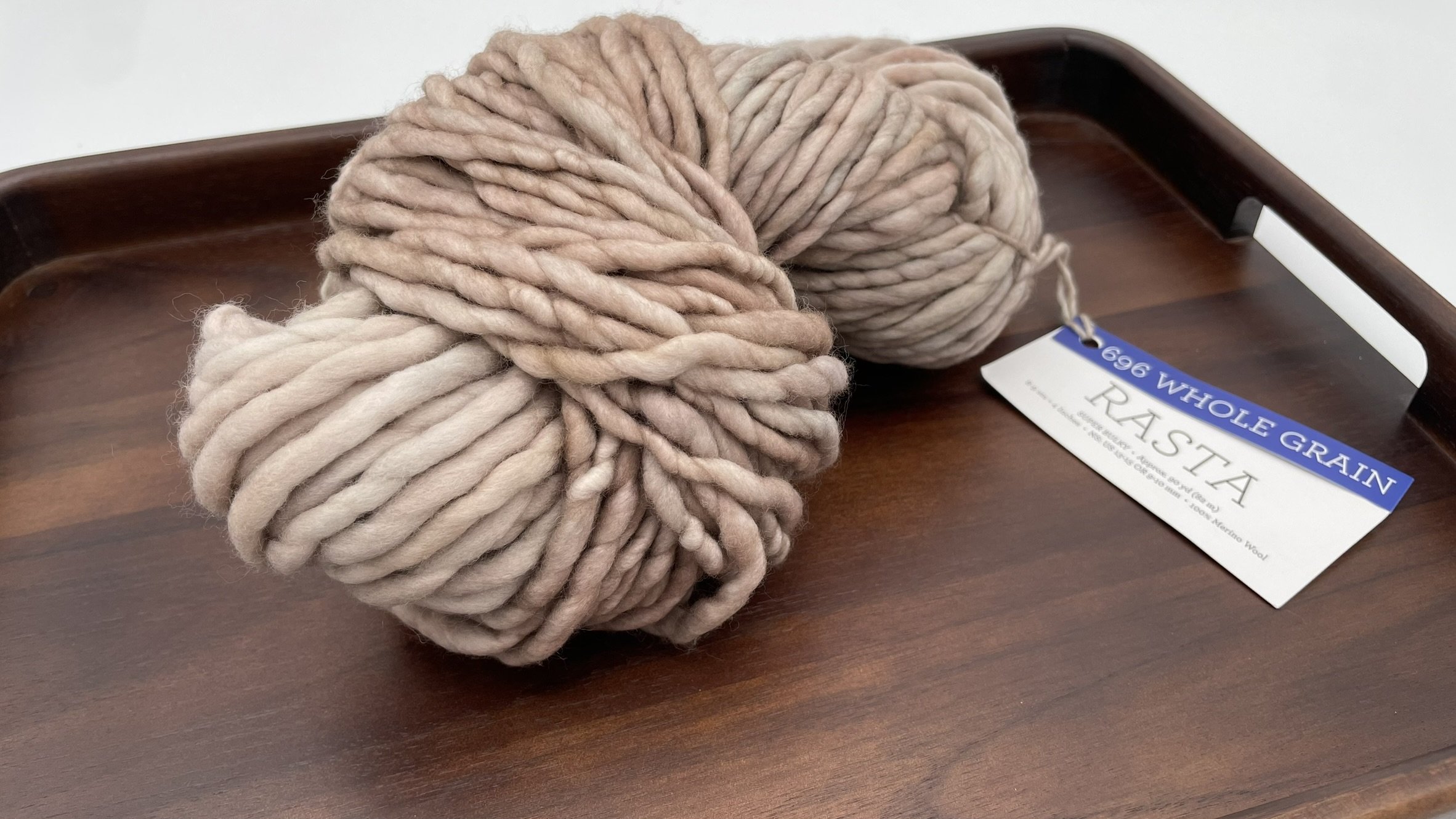 Second angle of Malabrigo Rasta yarn in Whole Grain color, showcasing warm neutral beige shades, 100% Merino wool.
