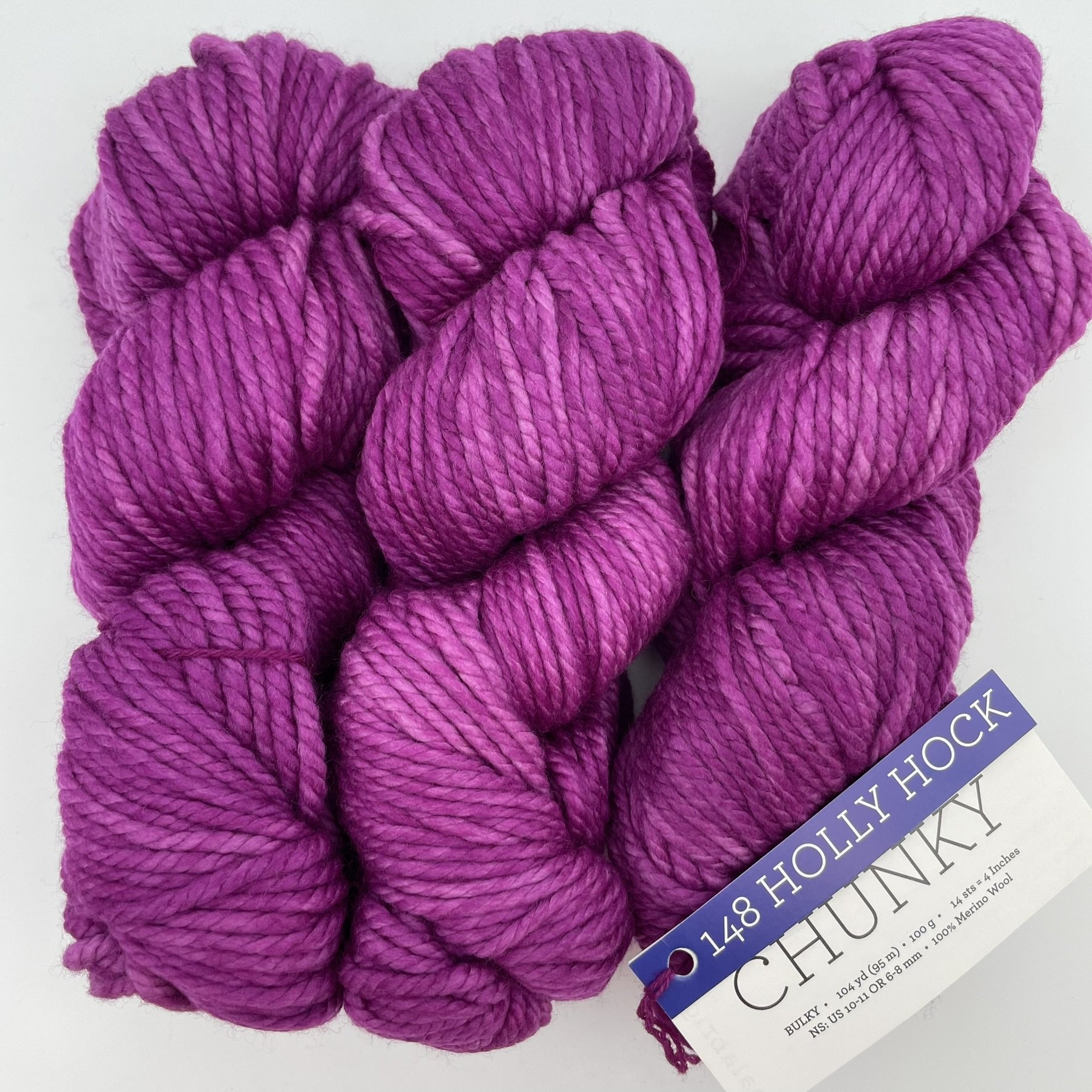 Malabrigo Chunky yarn in Holly Hock colorway, a bright purple bulky merino wool skein for knitting or crochet projects.
