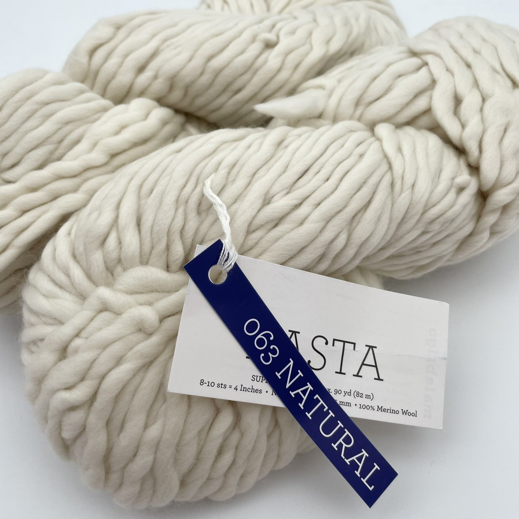 Close angle view of Malabrigo Rasta yarn in Natural color, showcasing super bulky texture and softness, 100% Merino wool.