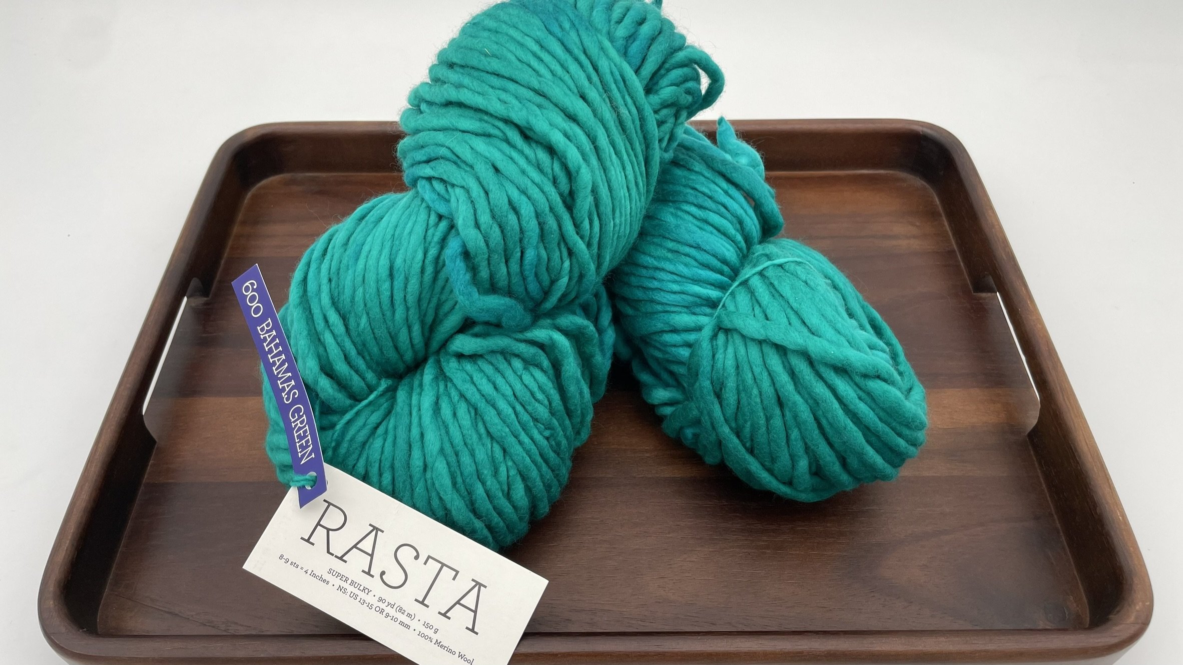 Malabrigo Rasta yarn in Bahamas Green colorway, a striking turquoise super bulky merino wool skein for knitting or crocheting.