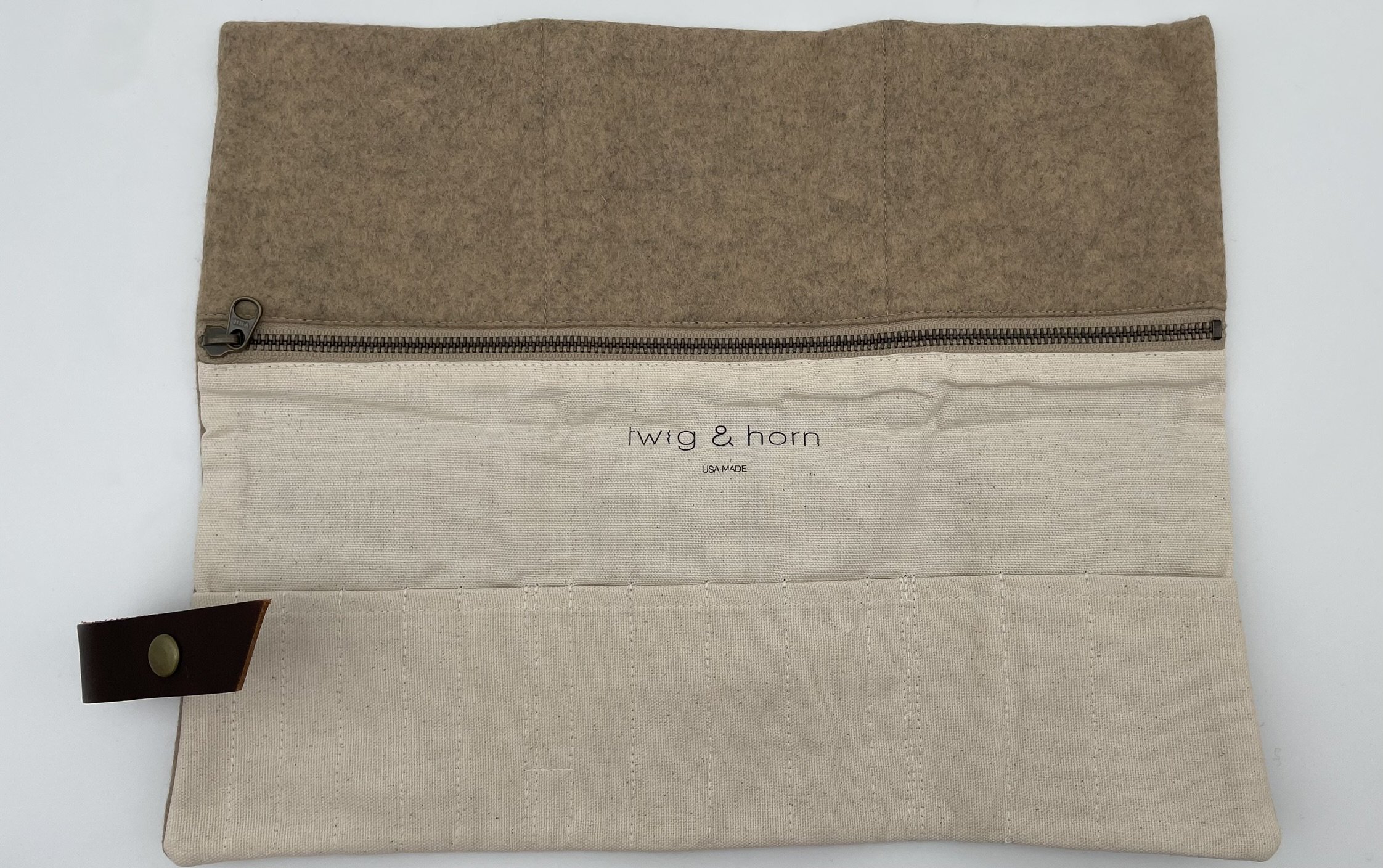 Twig & Horn natural wool knitting tool pouch fully opened to show multiple compartments and pockets for knitting accessories.