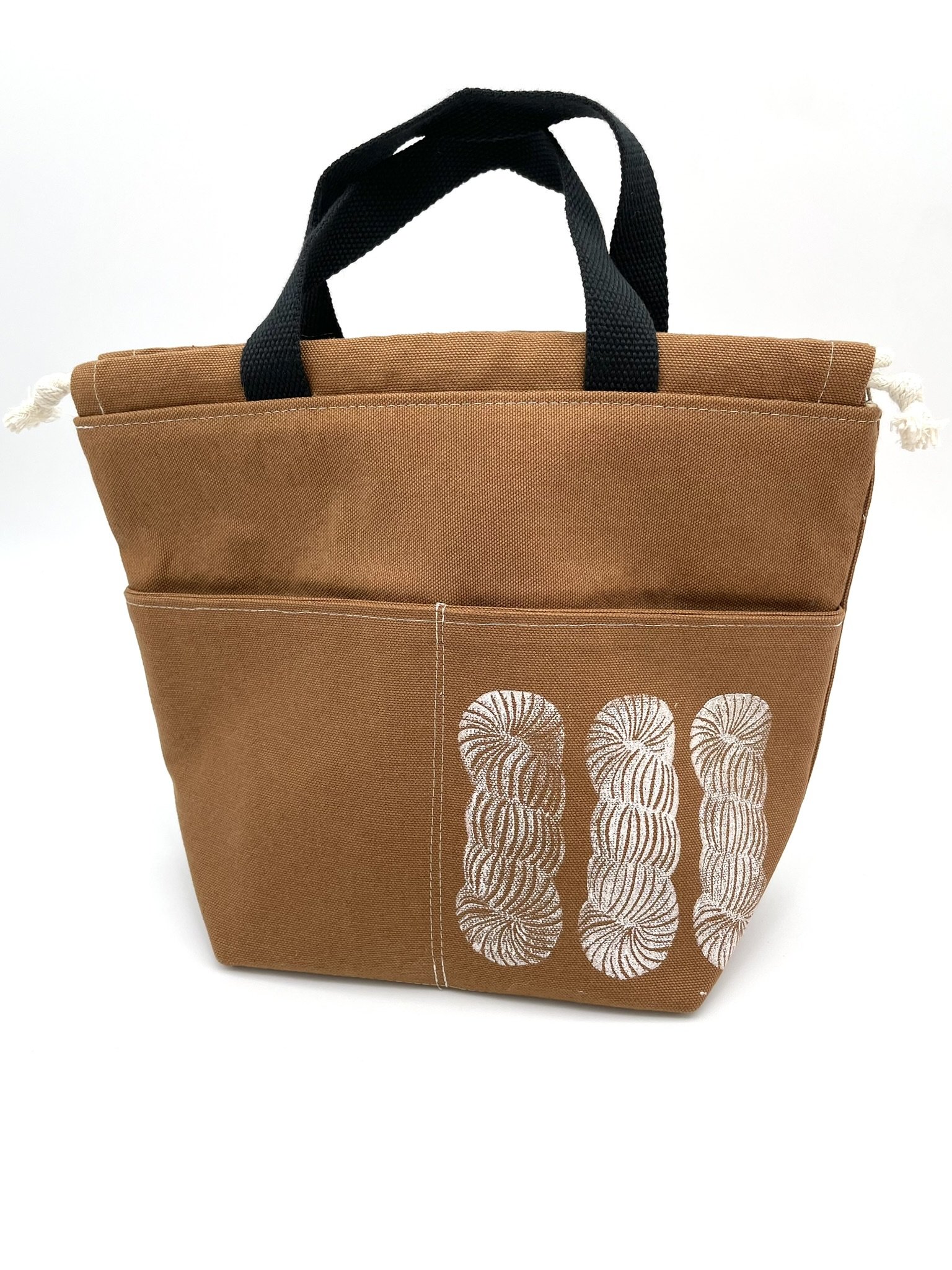 Front view of the small brown Puff Stitch project bag with skein design.