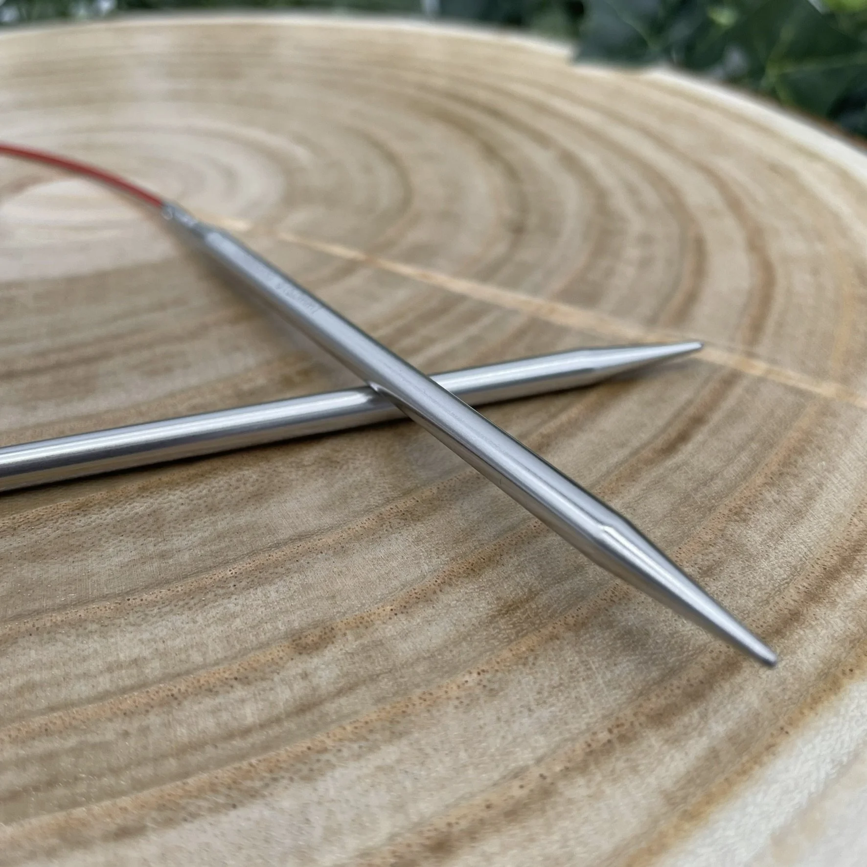 Chiaogoo fixed circular needle tips up close on wooden display