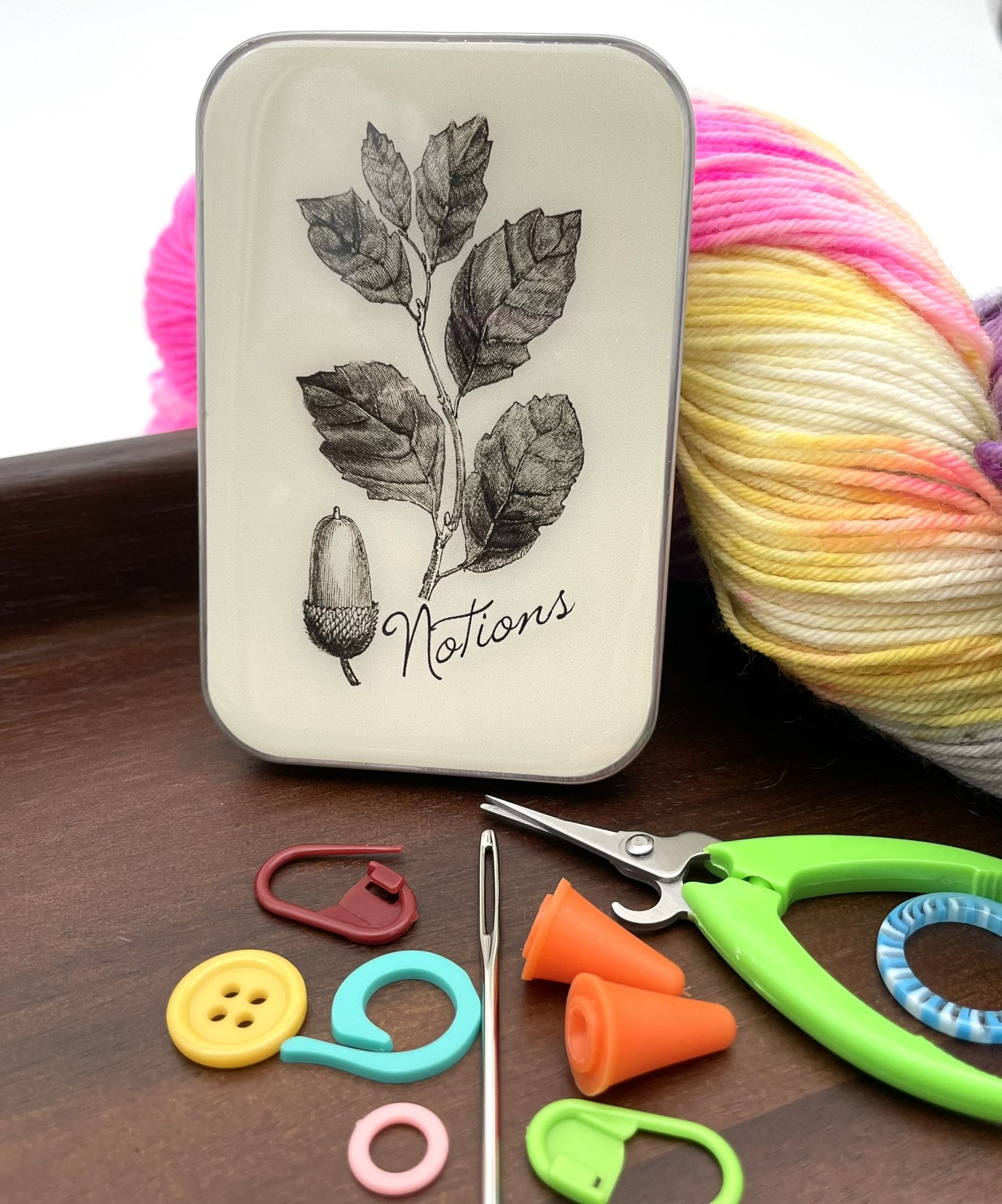 Upright acorn design notions tin by Firefly Notes for knitting and crochet tools.