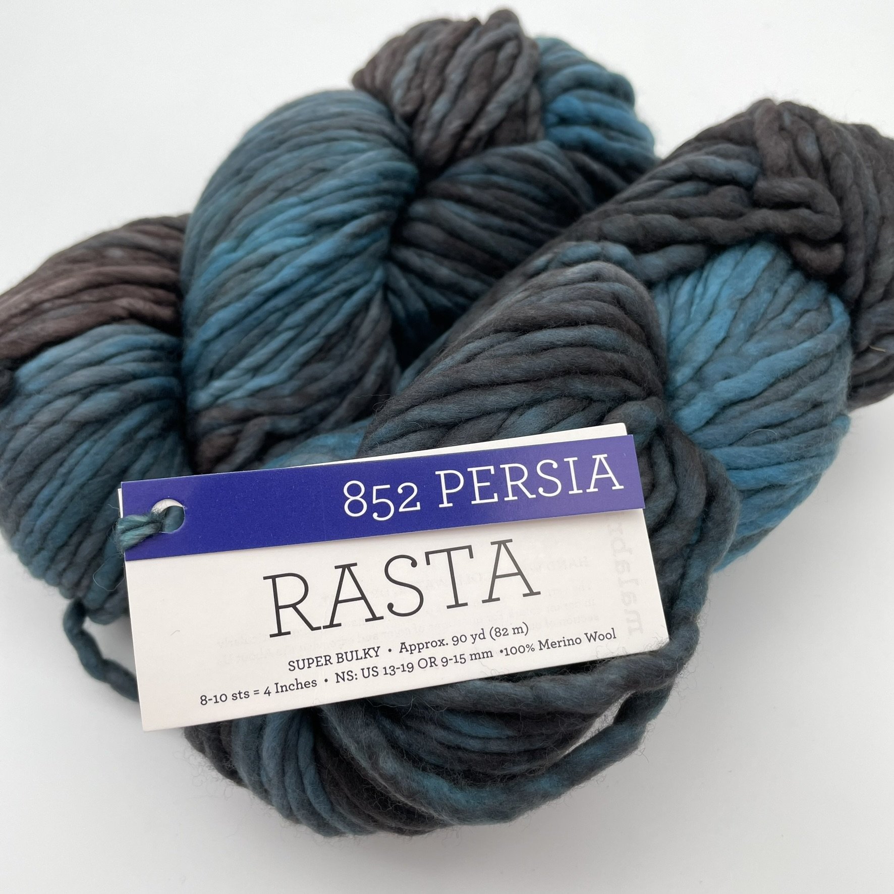 Malabrigo Rasta yarn in Persia color, featuring shades of blue and gray in a super bulky texture, 100% Merino wool.