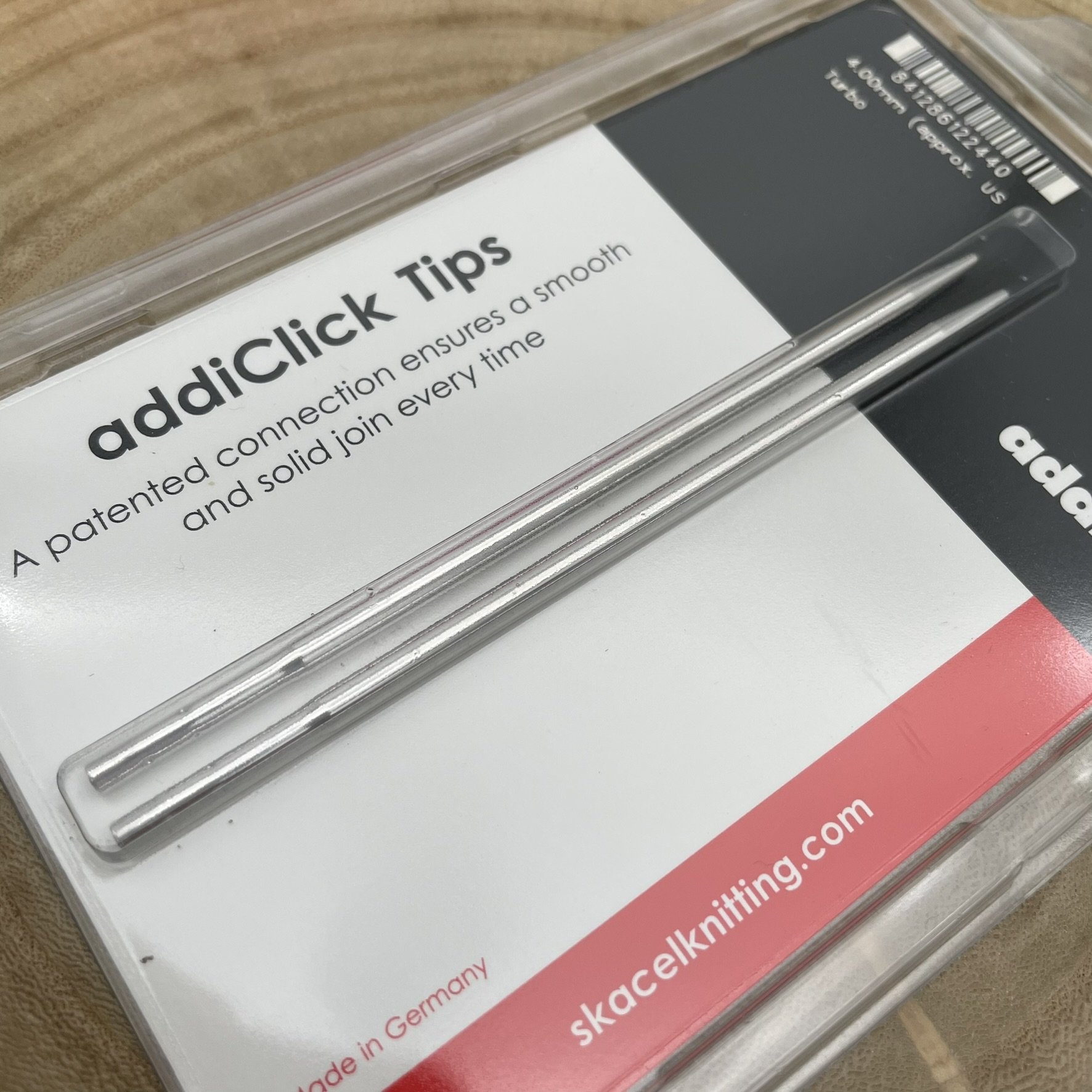 AddiClick Turbo knitting tips shown from an angle, featuring polished metal Turbo tips.