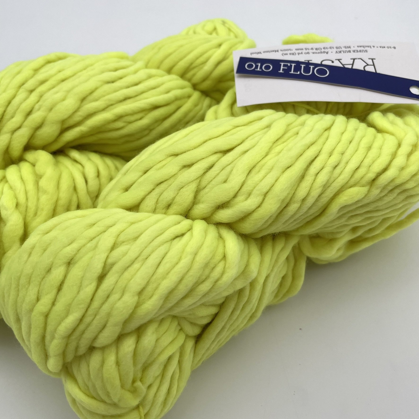 Close-up of Malabrigo Rasta yarn in Fluo colorway, featuring neon yellow tones in super bulky merino wool.