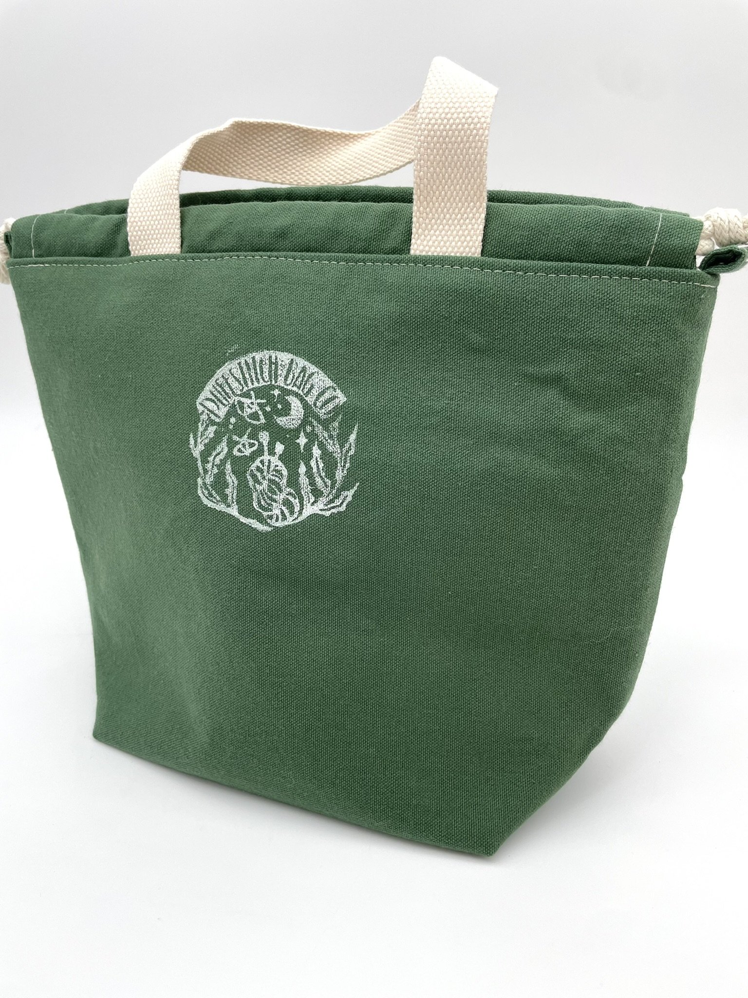 Back view of the small green Puff Stitch project bag showing durable canvas fabric.