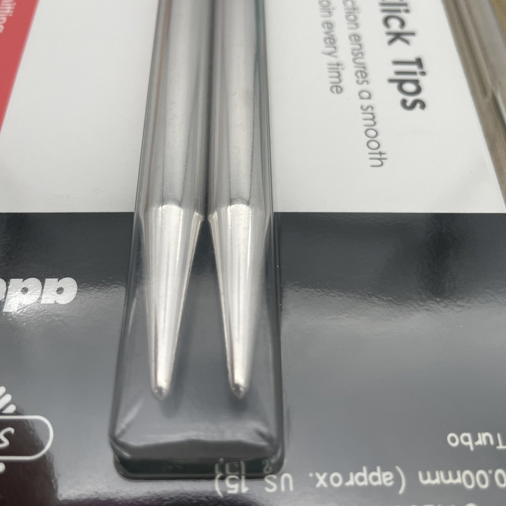 Close-up view of the AddiClick knitting tips showing the metal tips in focus.