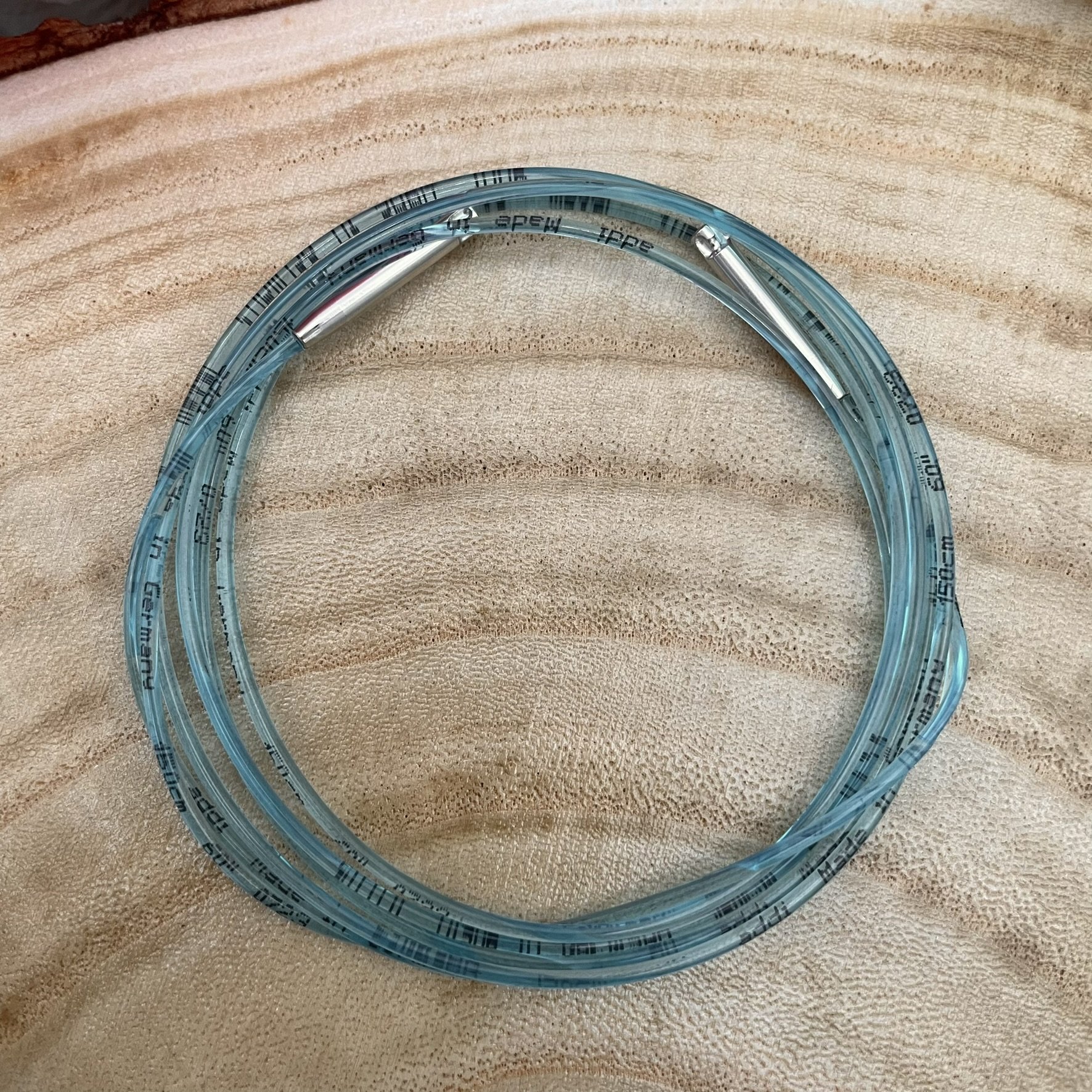 addiClick 60-inch cord, removed from the package, displaying the nylon cord and metal join points.