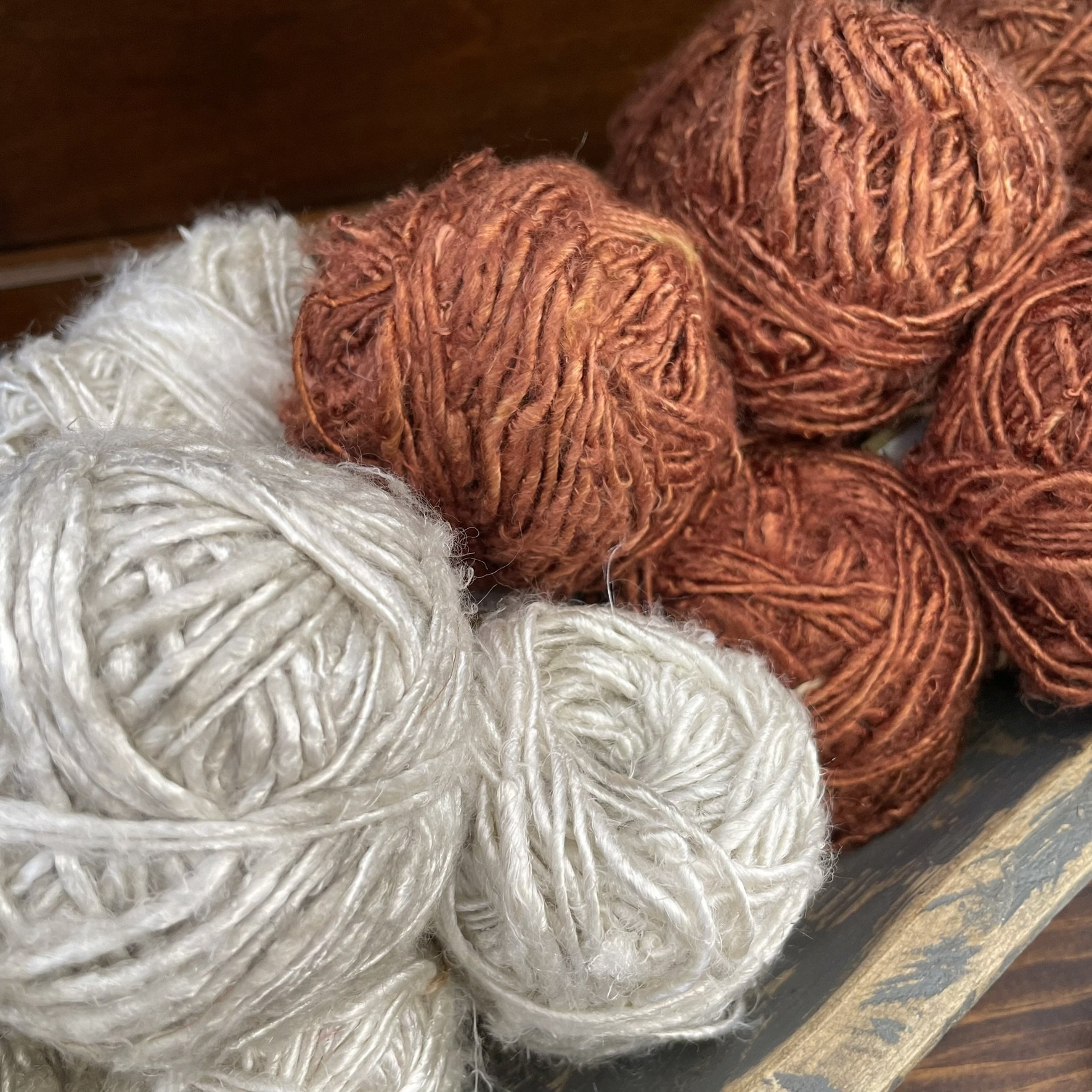 Banana fiber yarn in Ice White and Cedar Brown, eco-friendly natural yarn mix.
