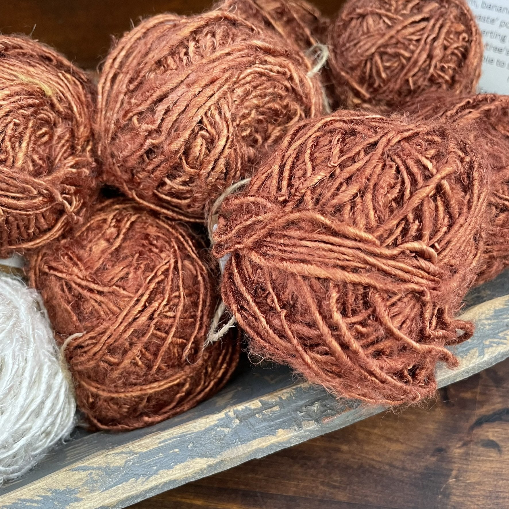 Close-up of Cedar Brown banana fiber yarn, showing its unique texture and rich brown color.