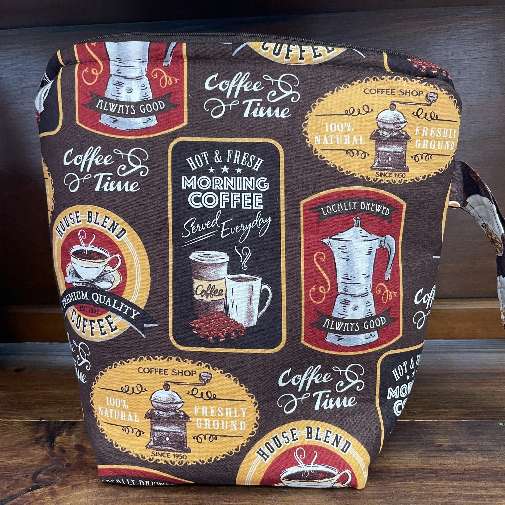 Back view of a large coffee-themed project bag with vintage coffee graphics, showcasing detailed fabric designs with coffee grinders and cups.