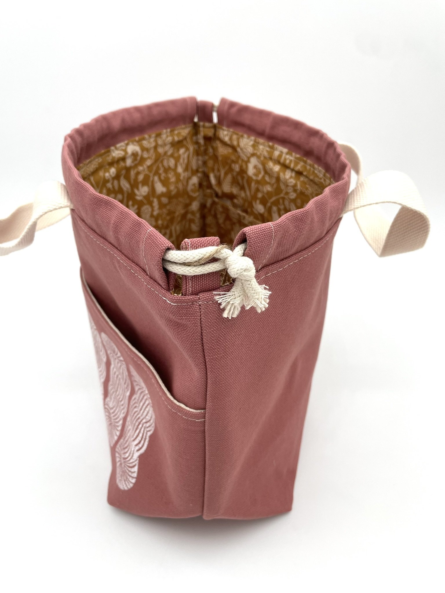 Side view of large pink Puff Stitch project bag with rope closure