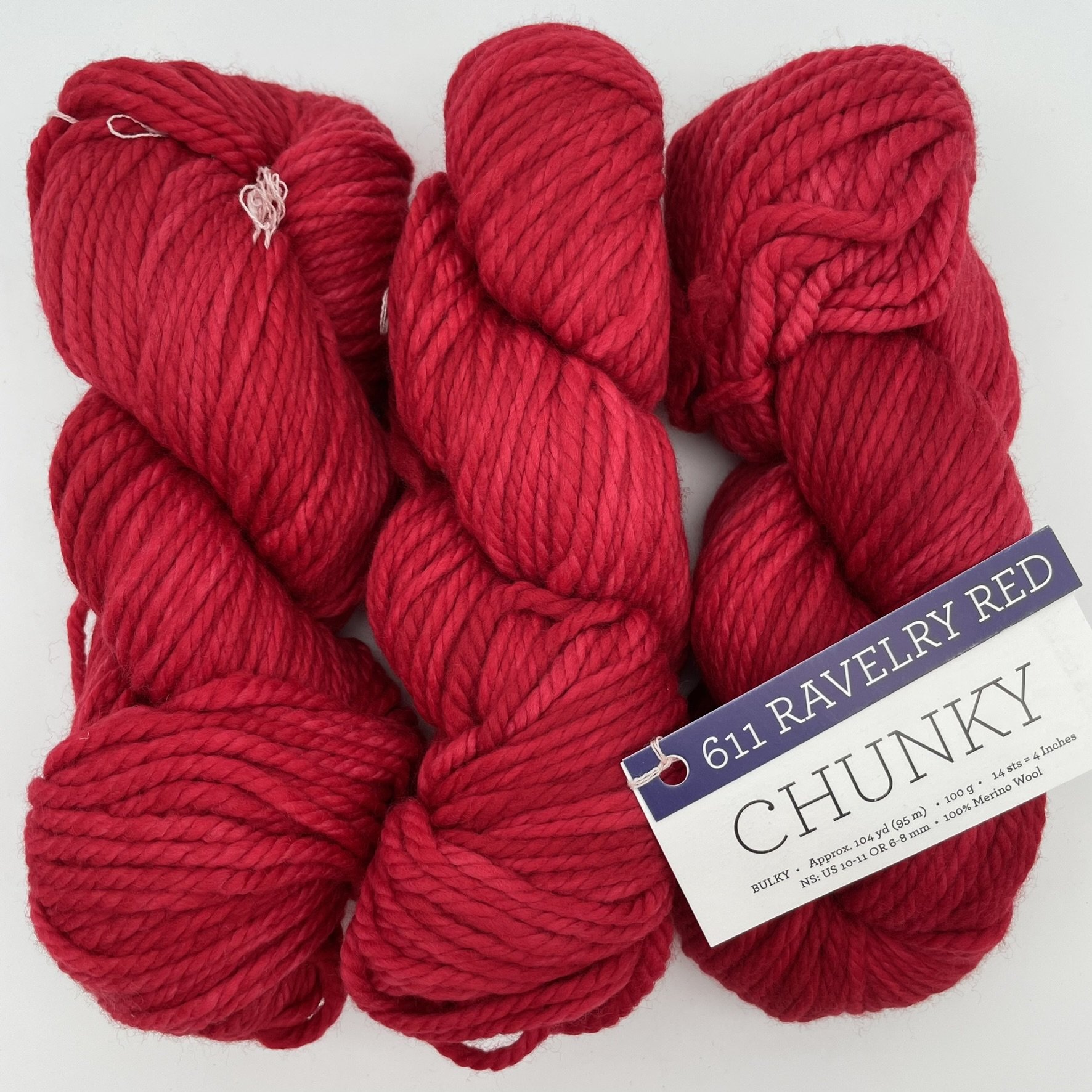 Malabrigo Chunky yarn in Ravelry Red colorway, a vibrant red bulky merino wool skein perfect for knitting or crocheting.