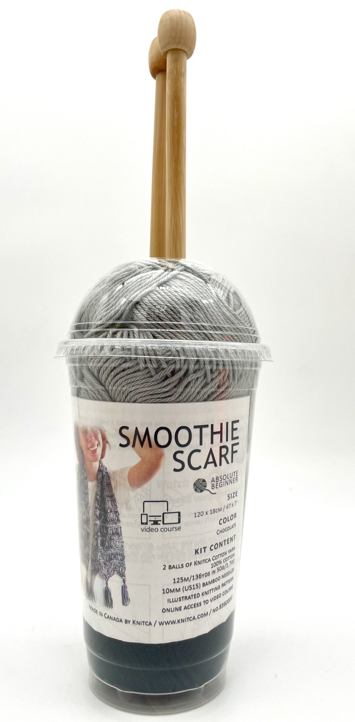 DIY Smoothie Scarf Knitting Kit by Knitca, front view of gray and black yarn in cup with wooden knitting needles.