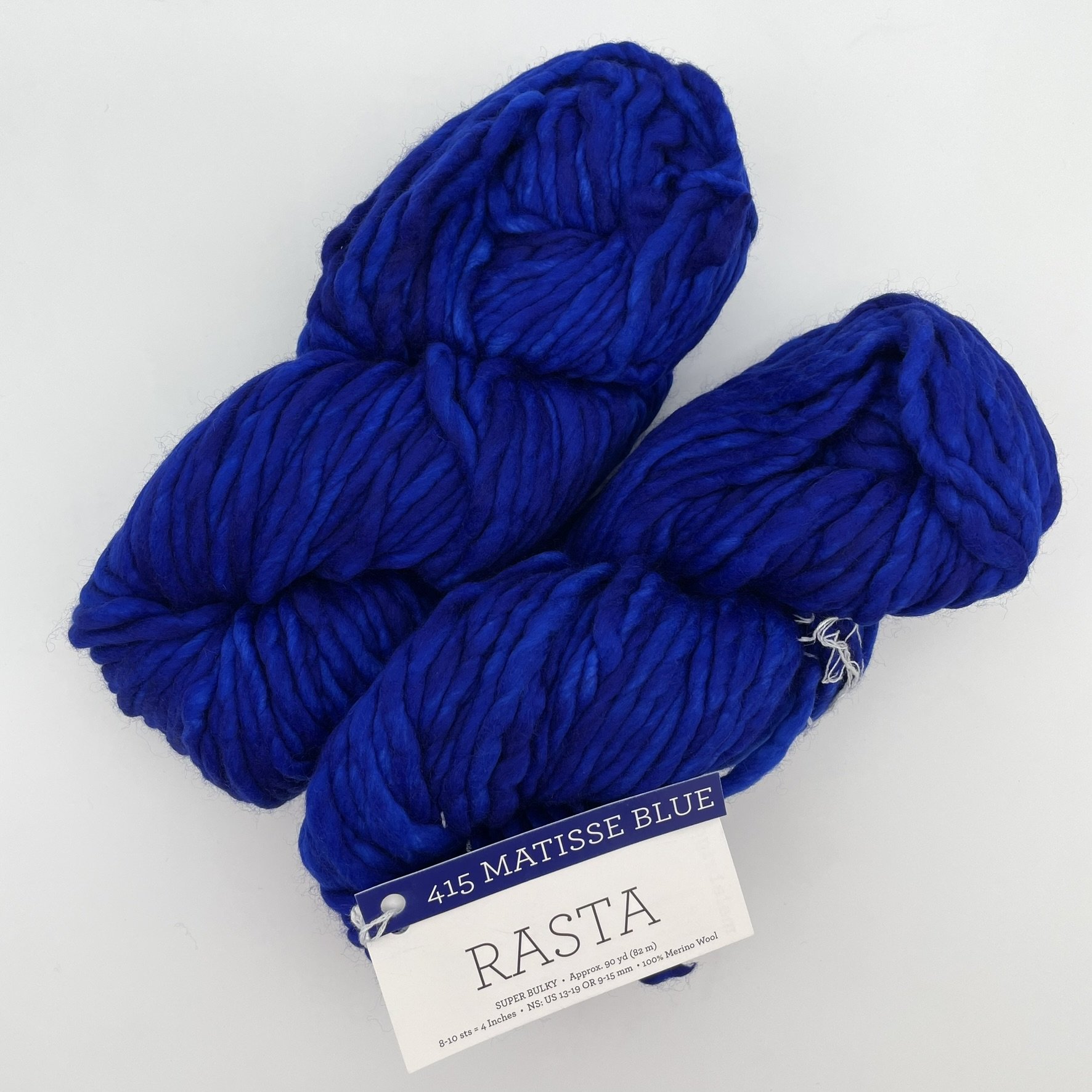 Malabrigo Rasta yarn in Matisse Blue colorway, a vibrant deep blue super bulky merino wool skein for knitting or crochet projects.
