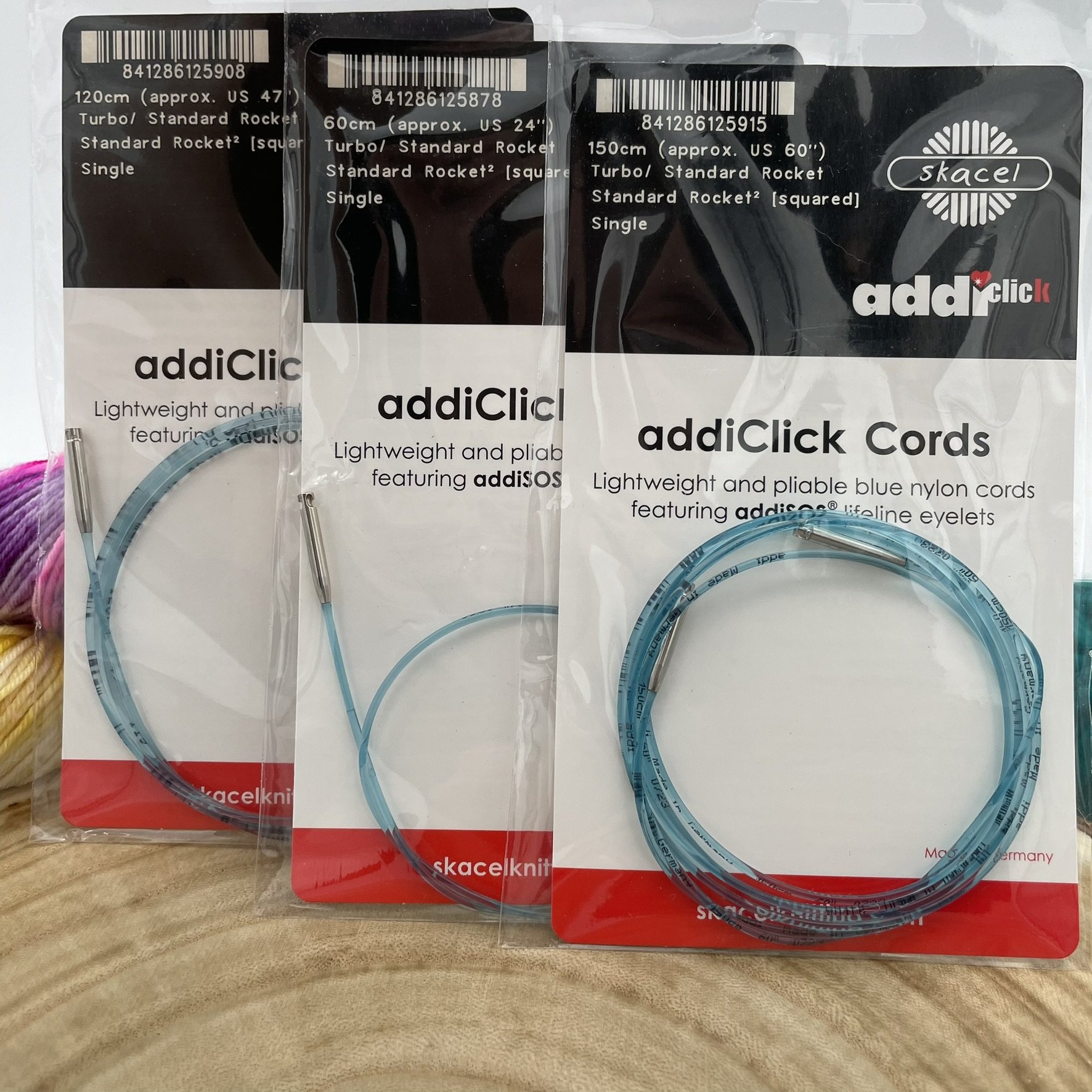Various lengths of addiClick cords in their packaging, showcasing flexibility in cord sizes.