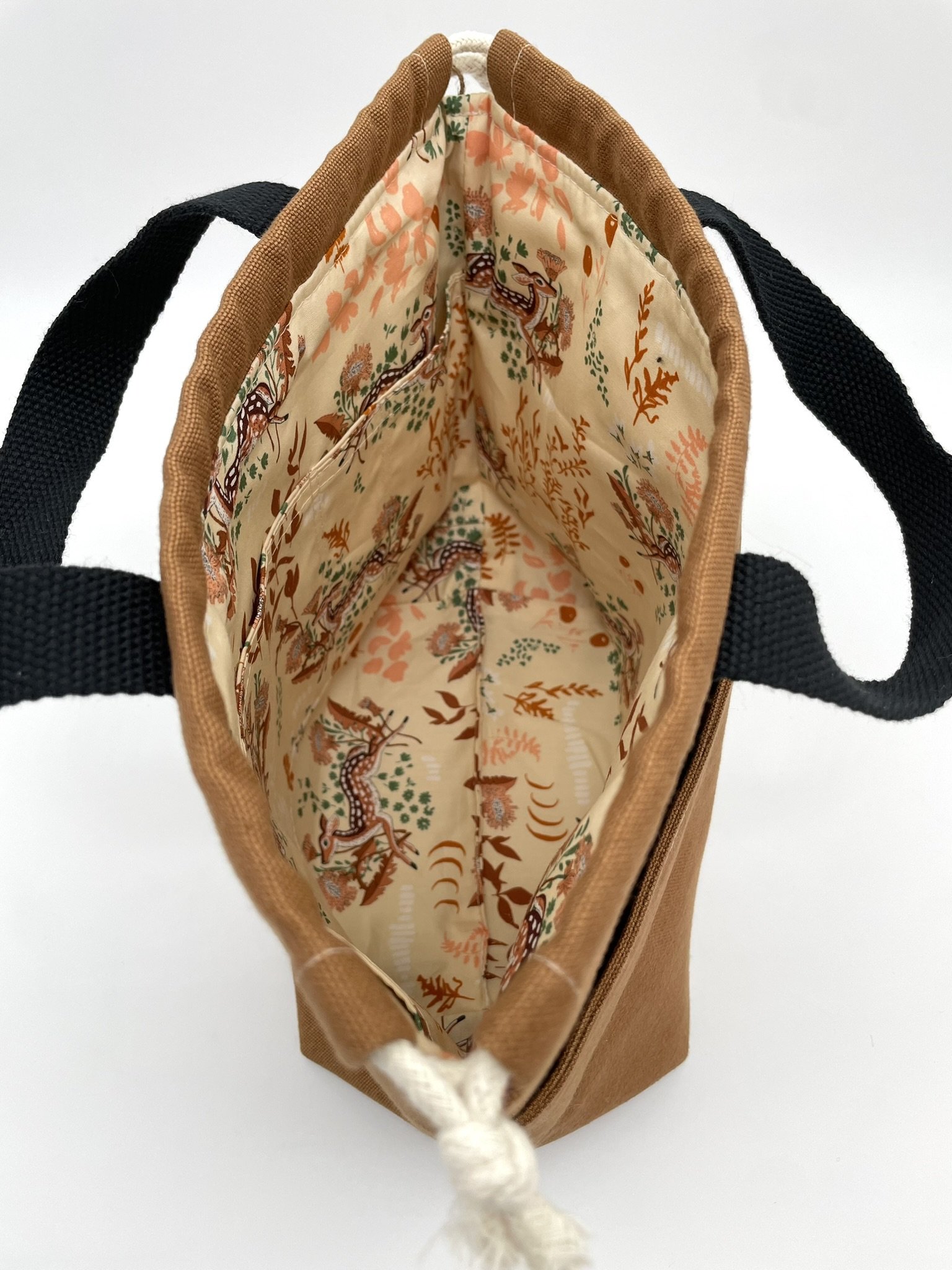 Inside view of the small brown Puff Stitch project bag with pattern lining.