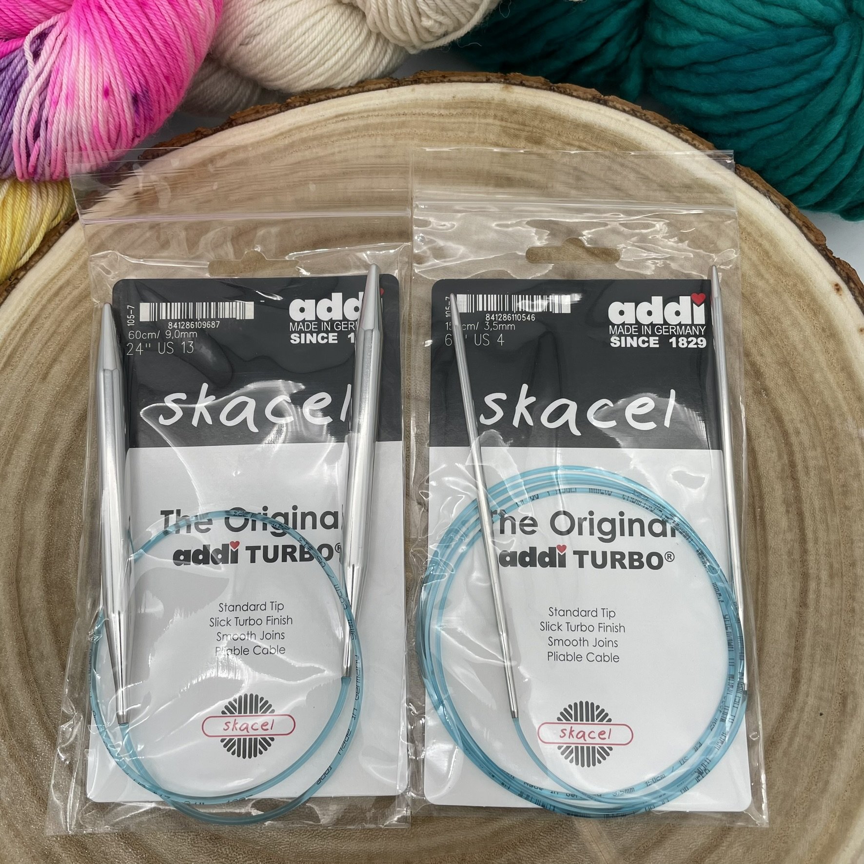 Addi Turbo fixed circular knitting needles in packaging, displayed in multiple lengths.