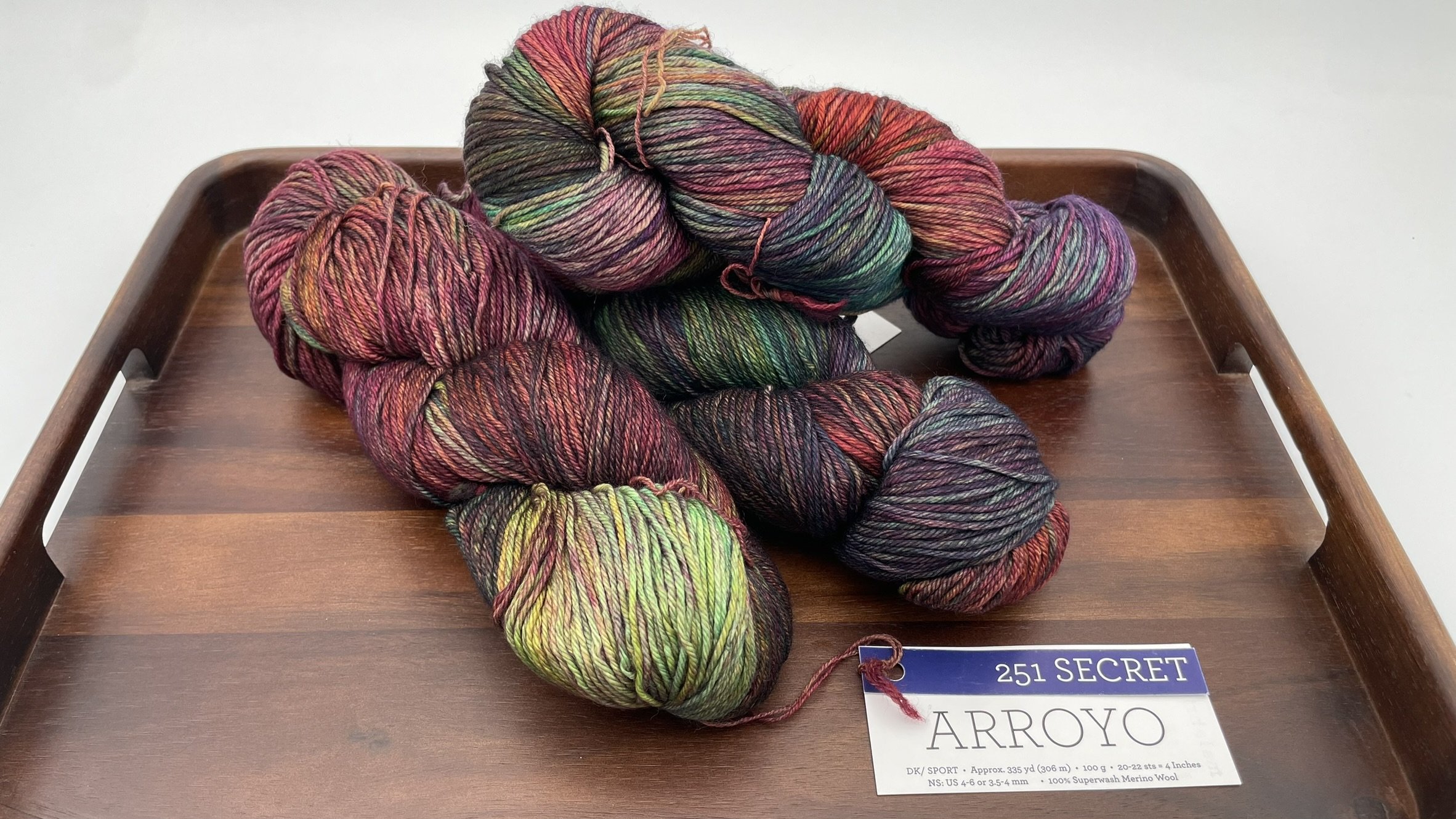 Close-up view of Malabrigo Arroyo Secret color yarn in DK/Sport weight, highlighting its rich and vibrant hues.