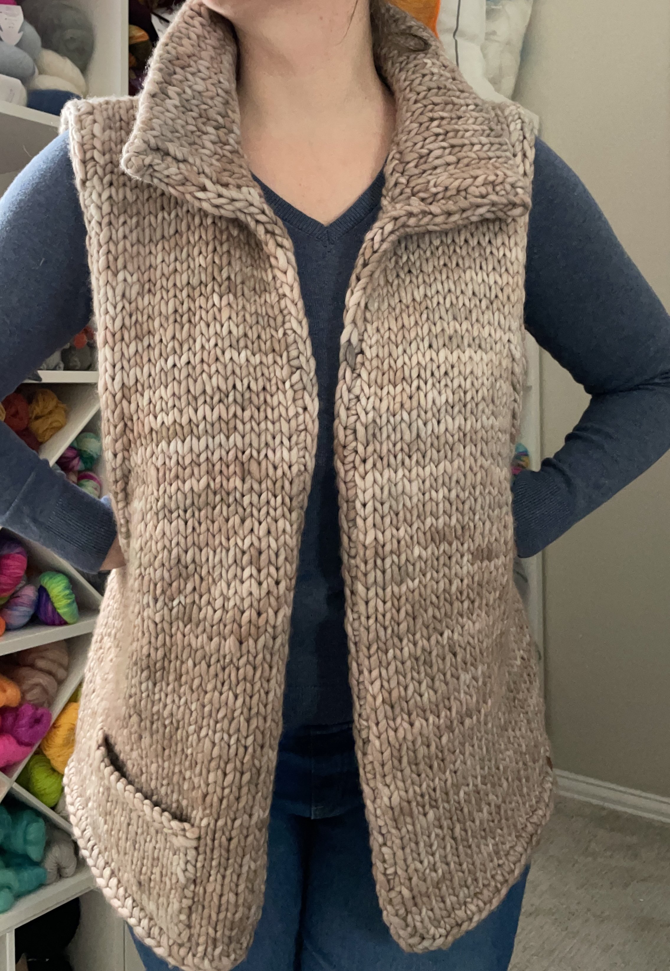 Front view of a hand-knit adventurer vest modeled on a person, showing the vest’s fit and texture.