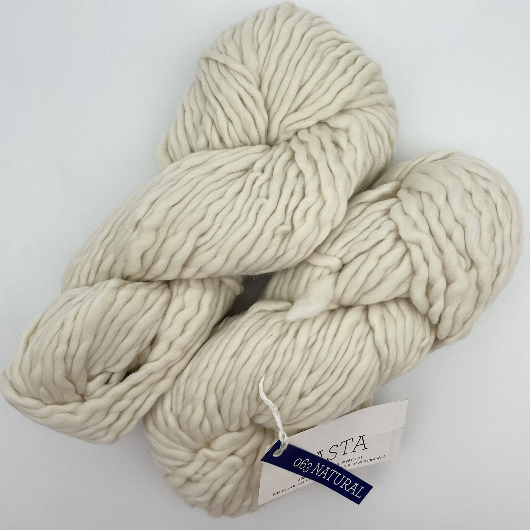Malabrigo Rasta yarn in Natural colorway, a soft cream white super bulky merino wool skein ideal for knitting or crocheting.