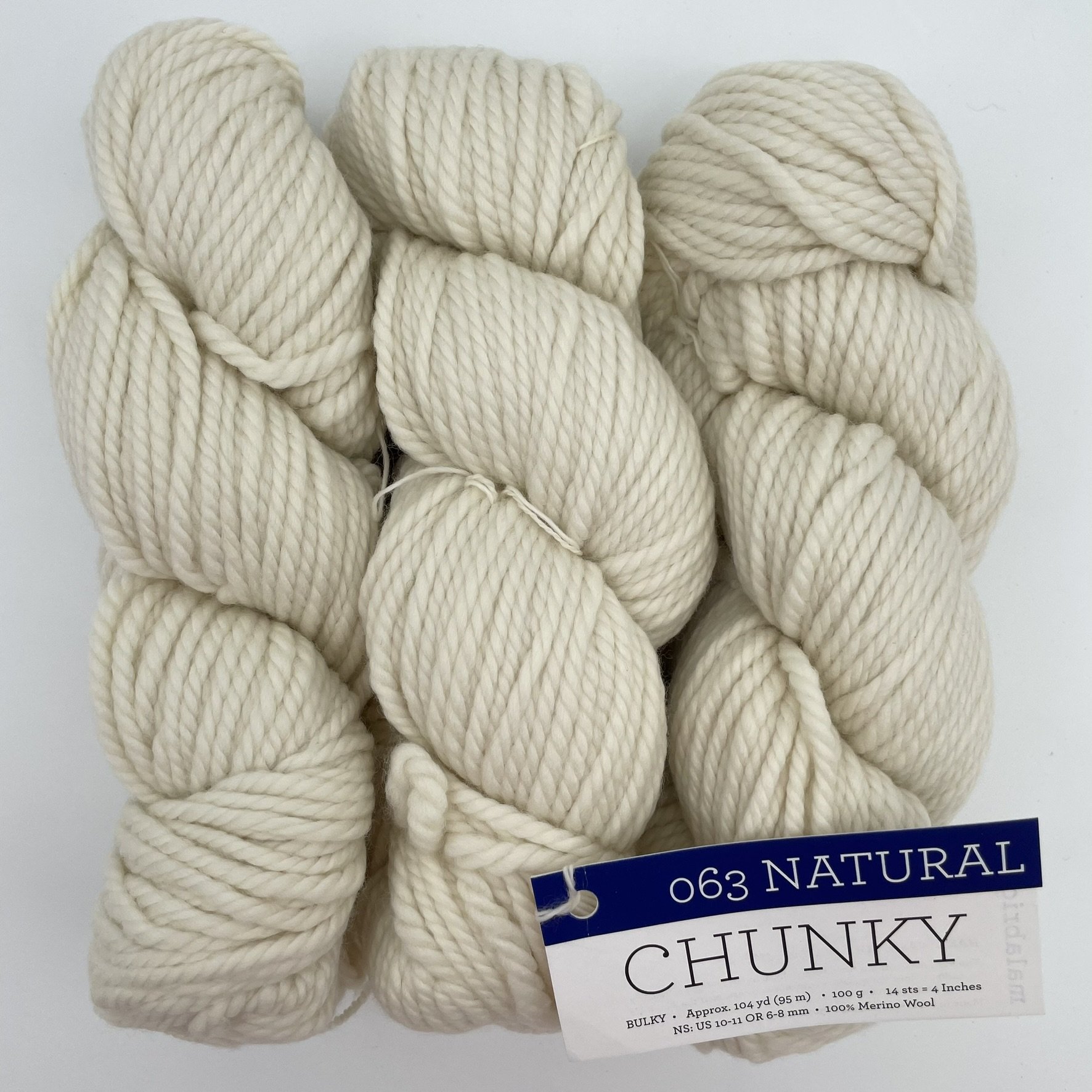 Malabrigo Chunky yarn in Natural colorway, a soft cream-colored bulky merino wool skein for knitting or crochet projects.