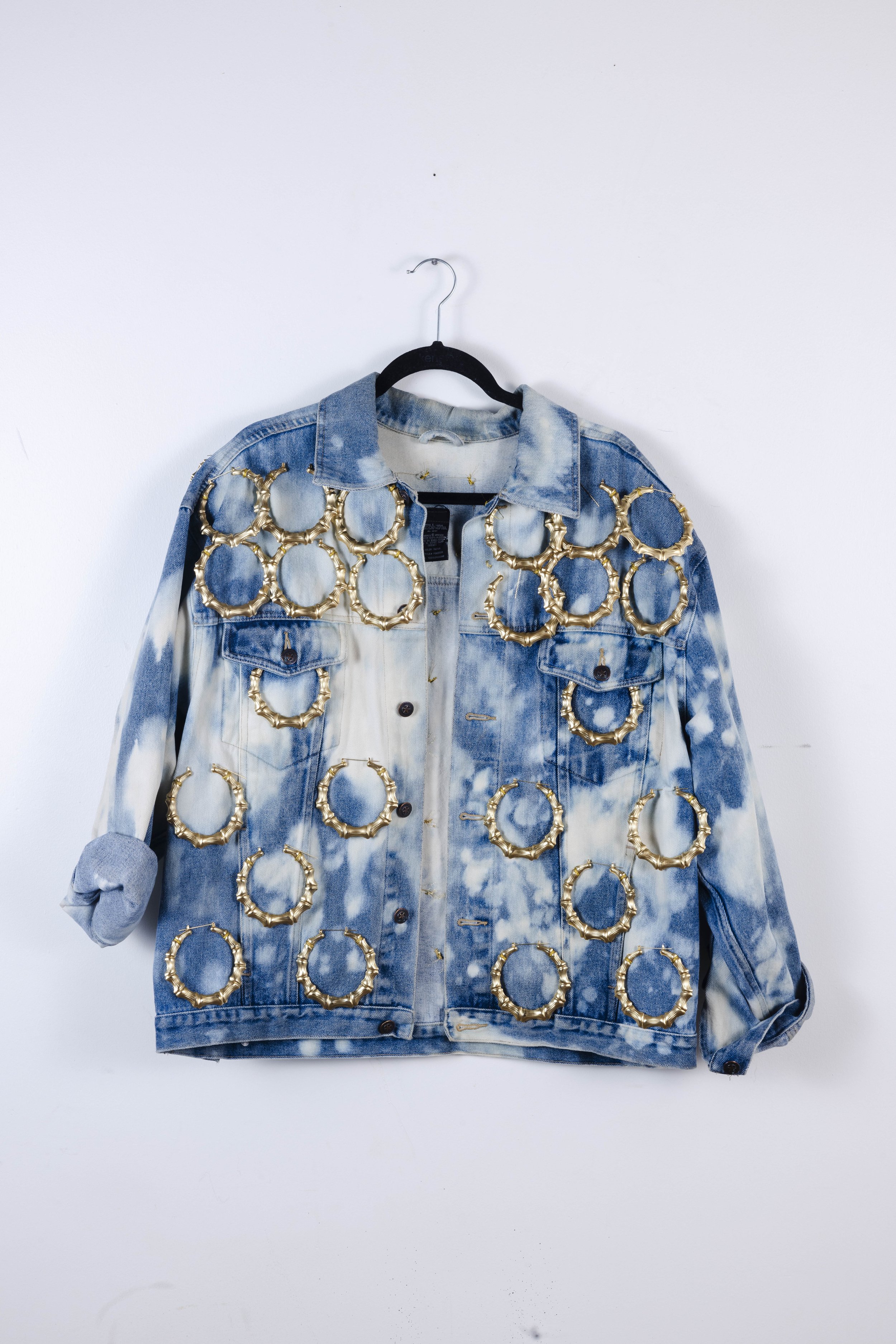 “Around the Way” Jacket
Designed for the GRWM Runway Collection, this piece is crafted from secondhand textiles and adorned with bamboo earrings sourced from a local beauty supply store. As an extension of the “Around the Way” Set, the jacket highlig