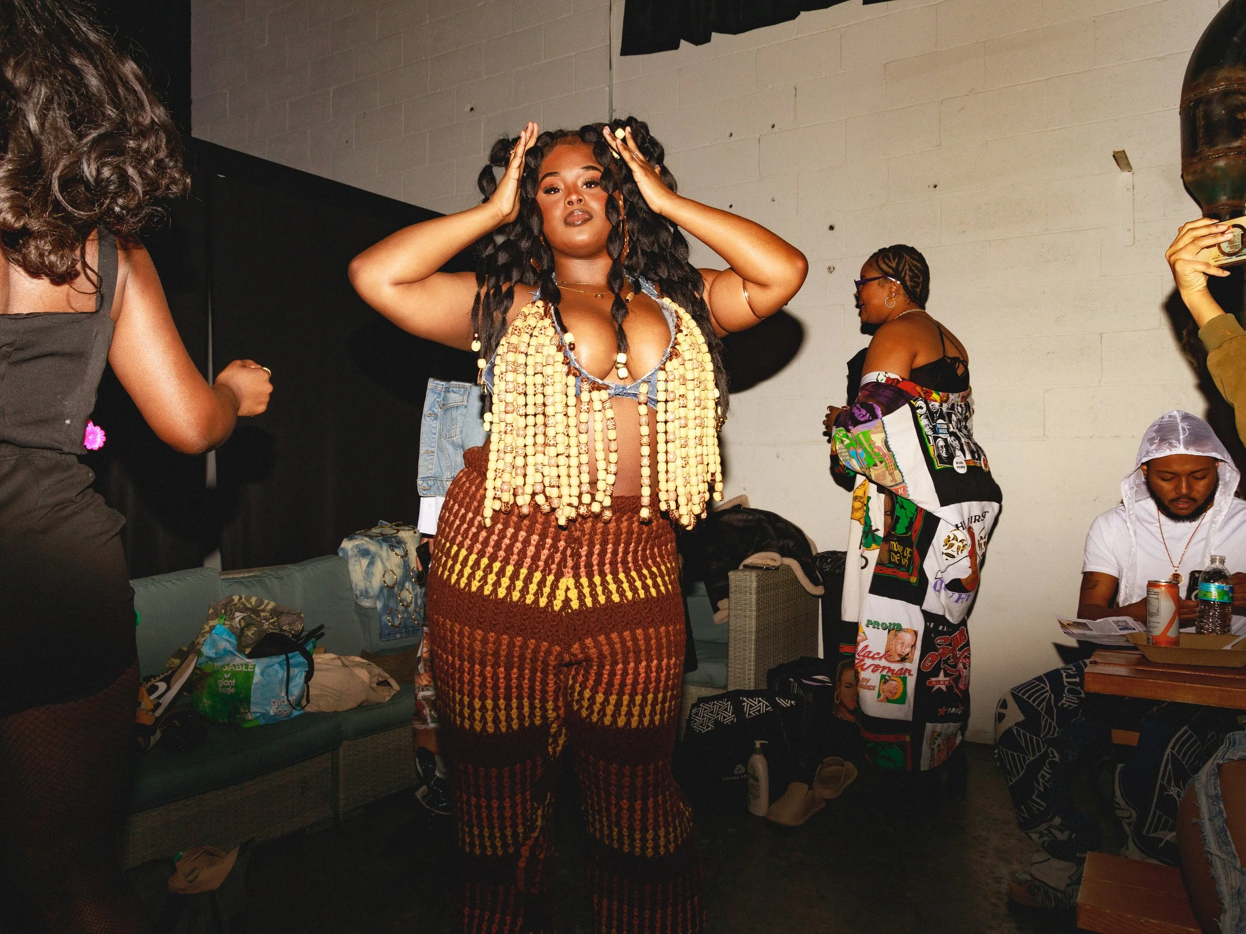 “Hair Me”
Created for the GRWM Runway Collection, this piece incorporates upcycled denim, braiding hair, and wooden beads to reflect Imani Batts’ personal hair story. The beads symbolize empowerment and boldness—qualities that cannot be hidden. With 