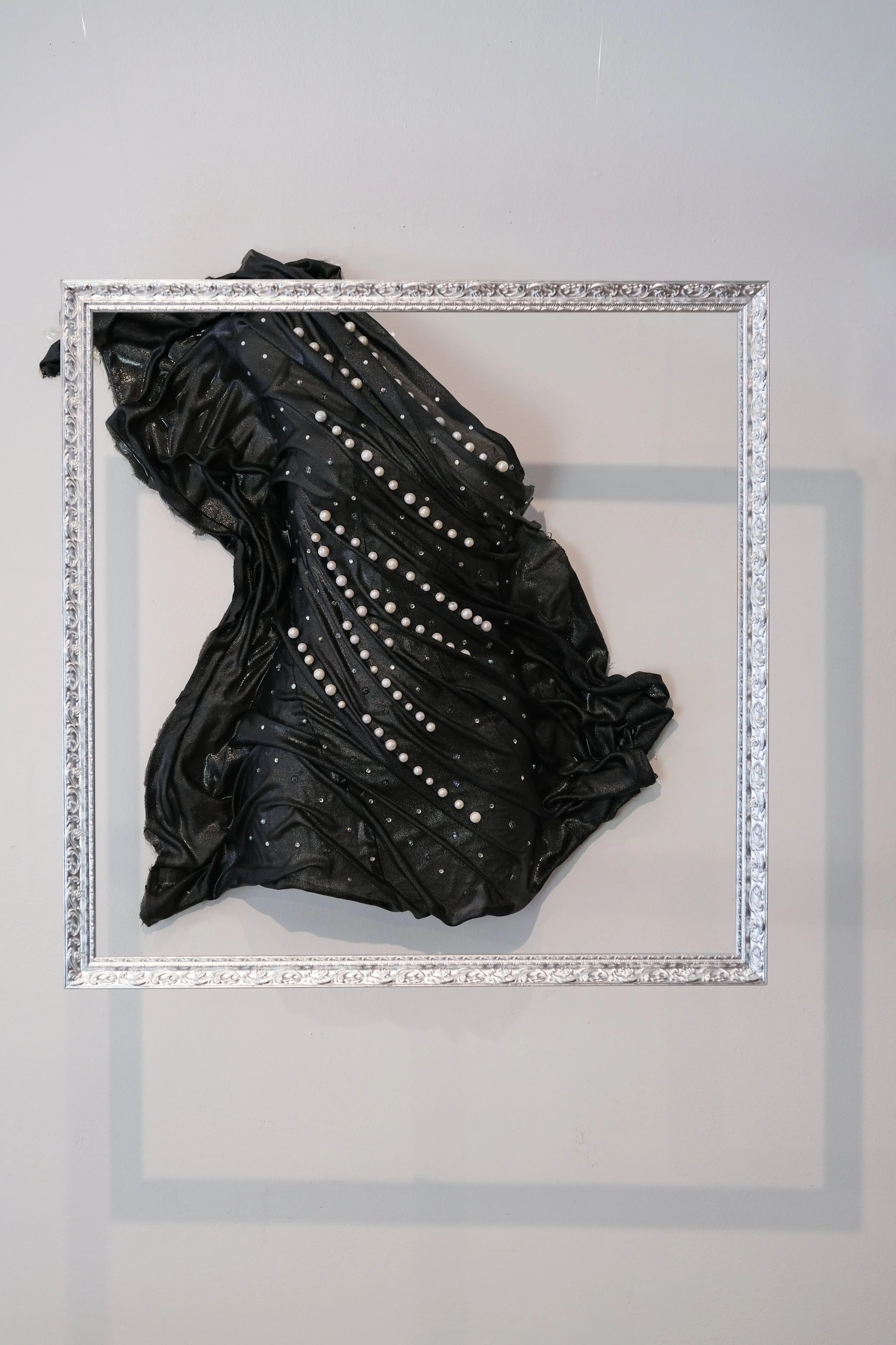 "Clinching My Pearls" 
Vera was the woman Floyd walked away from. A lover left in the shadow of his choices. Though she held onto hope, his absence carved out a quiet numbness in her. When he returned, asking for another chance, the pain resurfaced. 