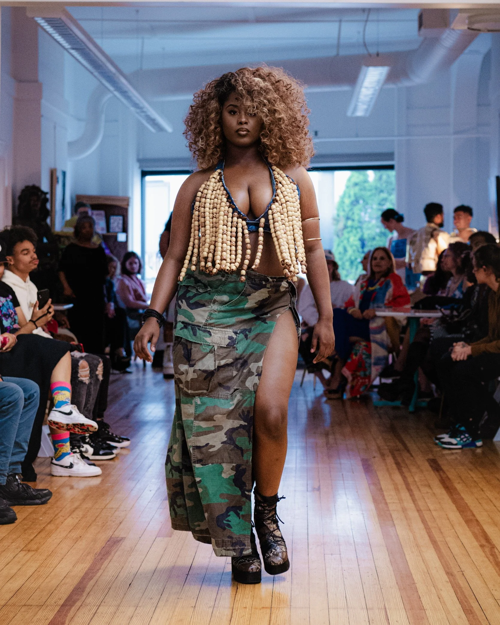 “Hair Me”
Created for the GRWM Runway Collection, this piece incorporates upcycled denim, braiding hair, and wooden beads to reflect Imani Batts’ personal hair story. The beads symbolize empowerment and boldness—qualities that cannot be hidden. With 