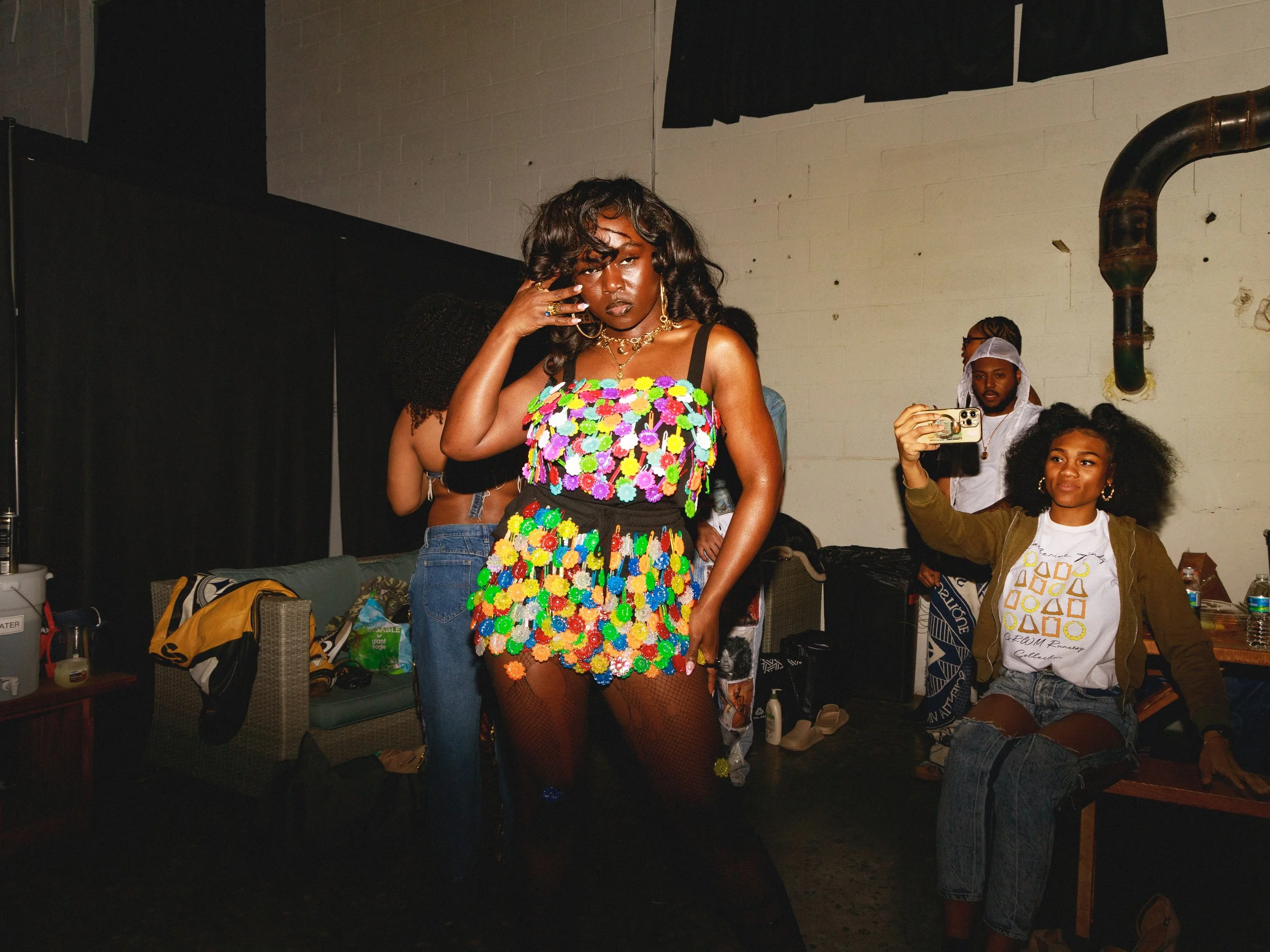 “Play Time”
Handcrafted for the GRWM Runway Collection, this piece is made from secondhand textiles and adorned with colorful hair barrettes. The garment embodies Imani’s inner child, with each hand-sewn barrette symbolizing the joy and playful energ