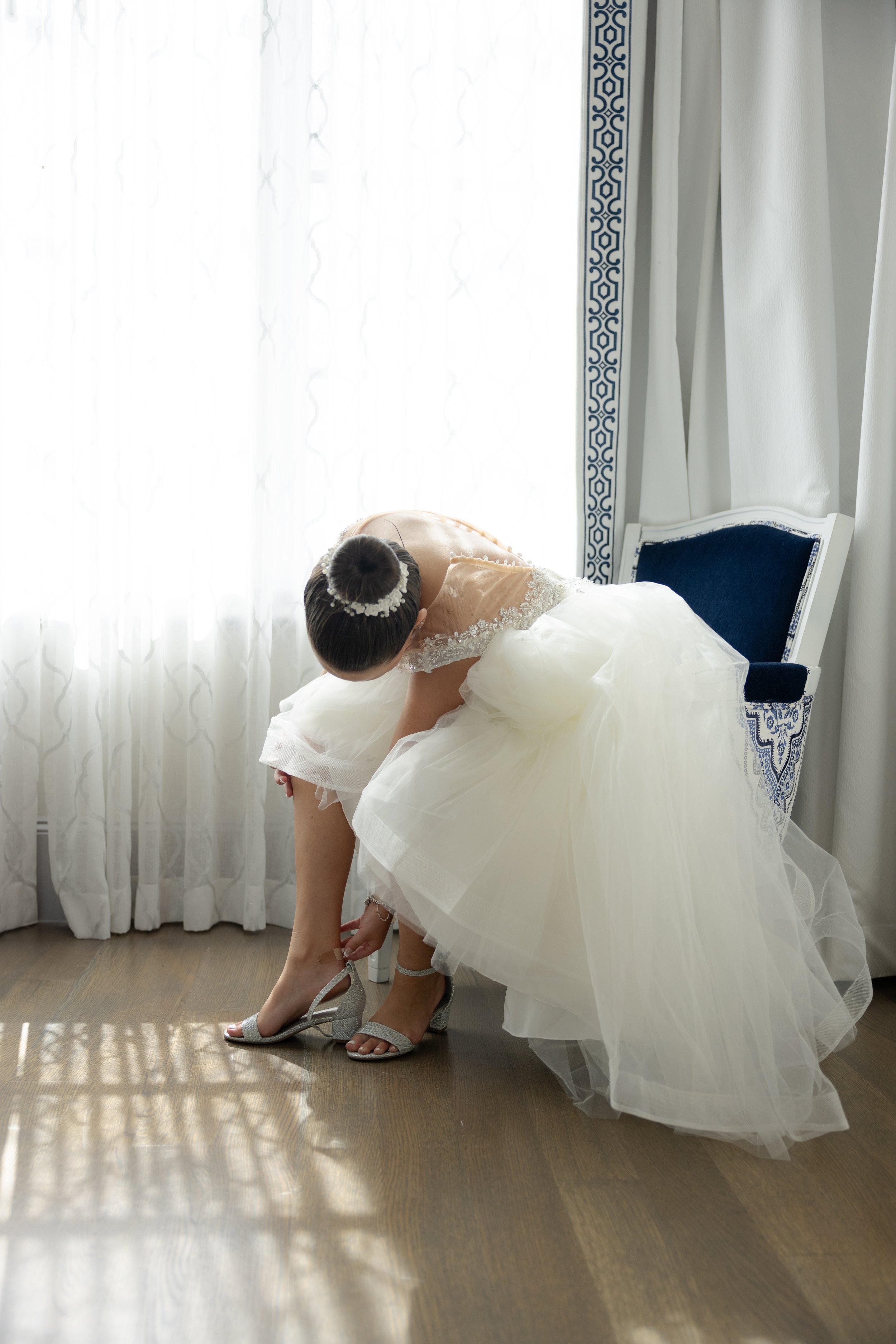 Young bridesmaid getting ready for wedding day