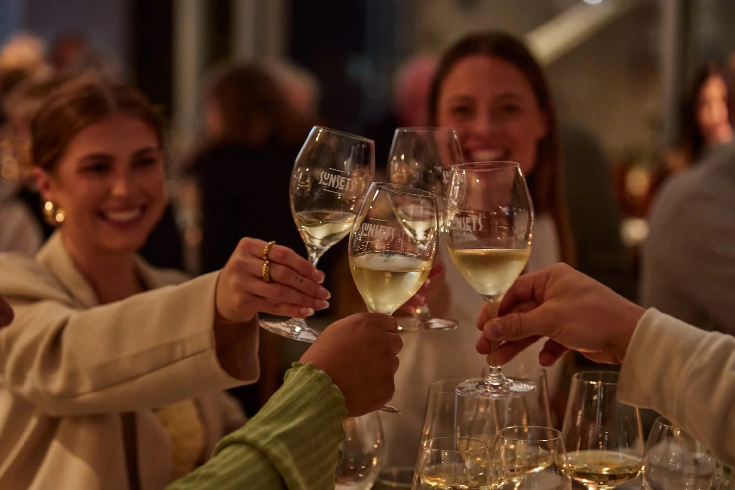 Guests raising a toast at an evening celebration