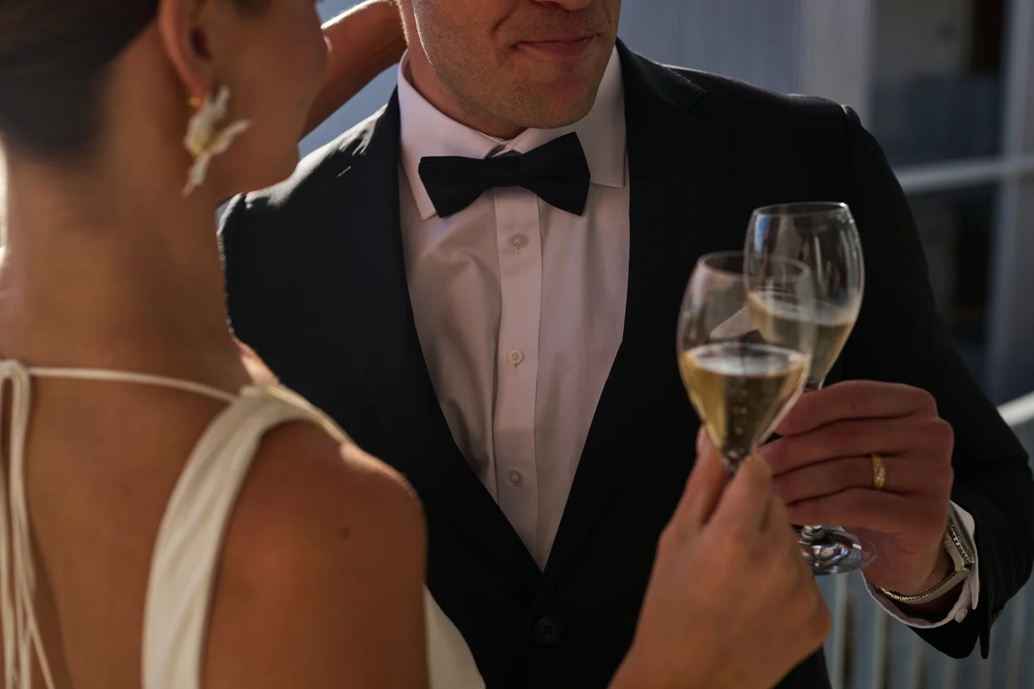 A bride and groom raising a toast