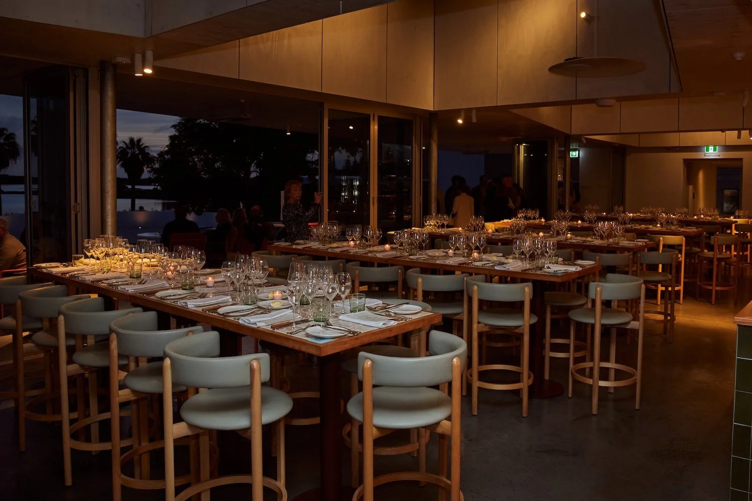Long table set for group dining at Sunsets Bar and Dining
