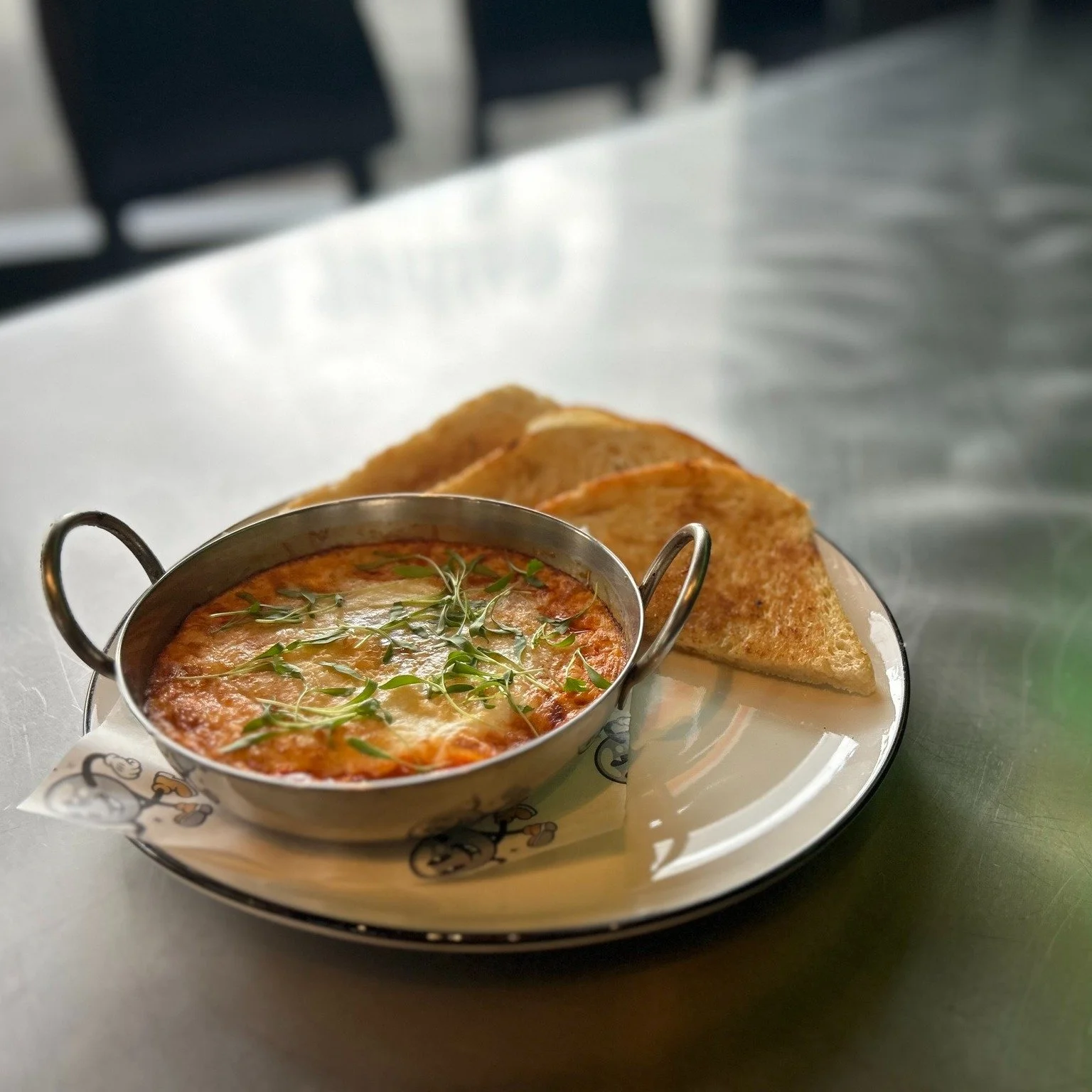 Don't forget about brunch tomorrow from 11am-3pm! Plus you get a free pinball wristband with any brunch food purchase

The Eggs in Purgatory is one of our staff favorites. Two eggs baked in tomato sauce, covered in parmesan, served with sourdough toa