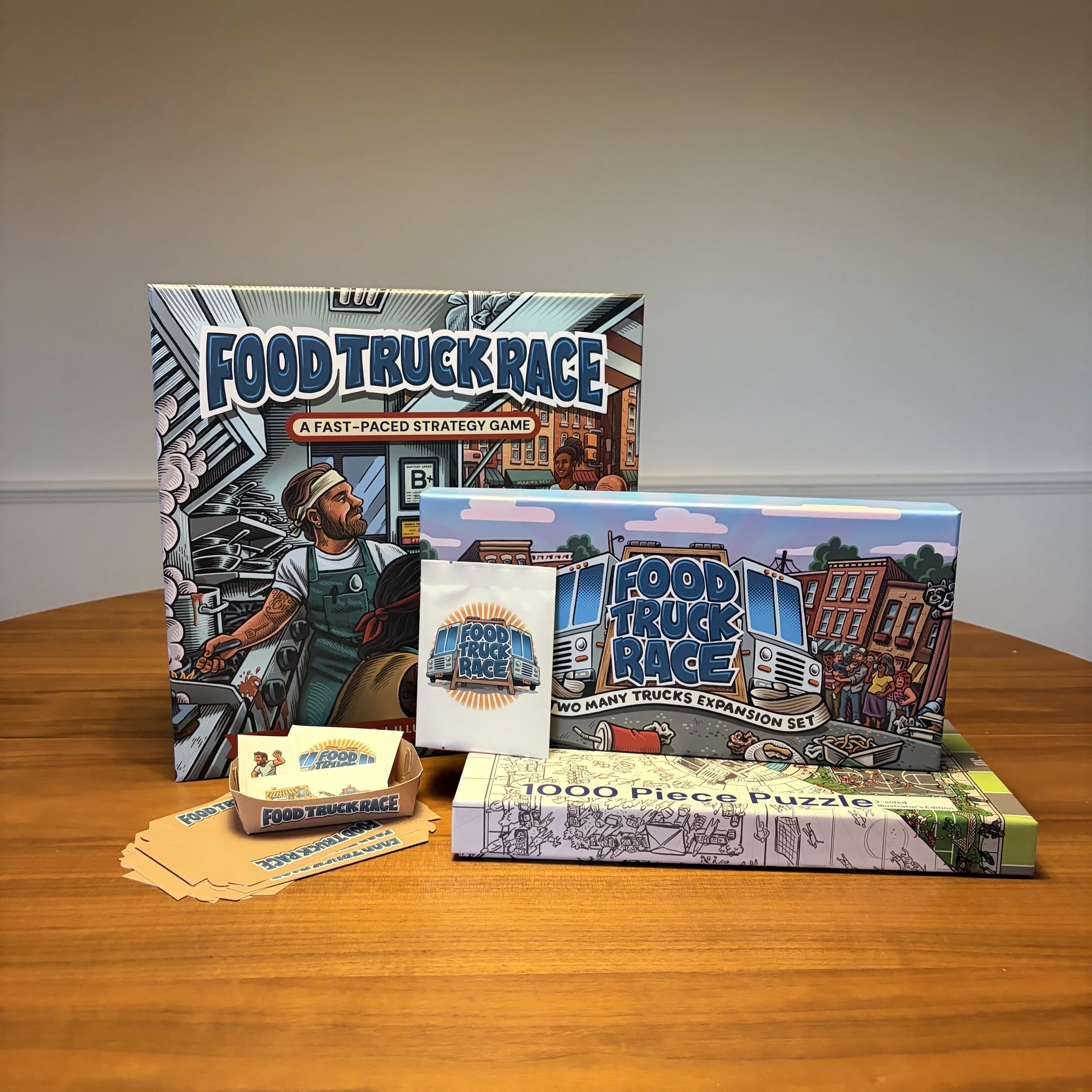 A collection of board games and puzzle sets, including 'Food Truck Race' and a 1000-piece puzzle, displayed on a wooden table.