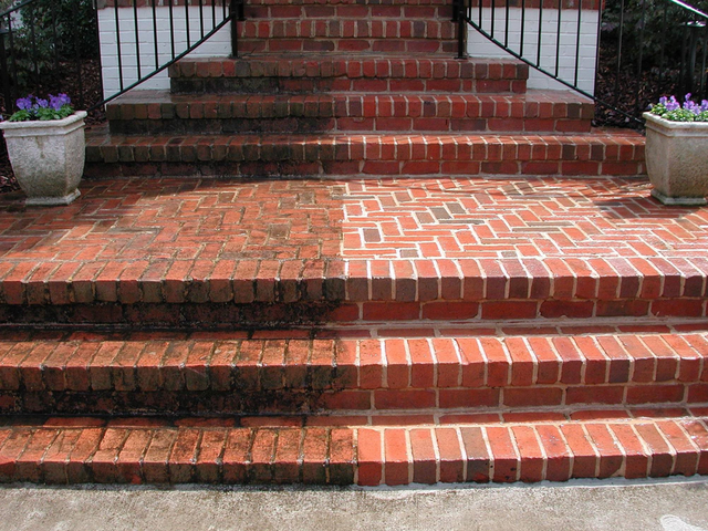 Comparison of brick walkway and stairs before (left) and after (right) pressure washing services.