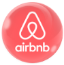 Airbnb logo on a pink circular background
