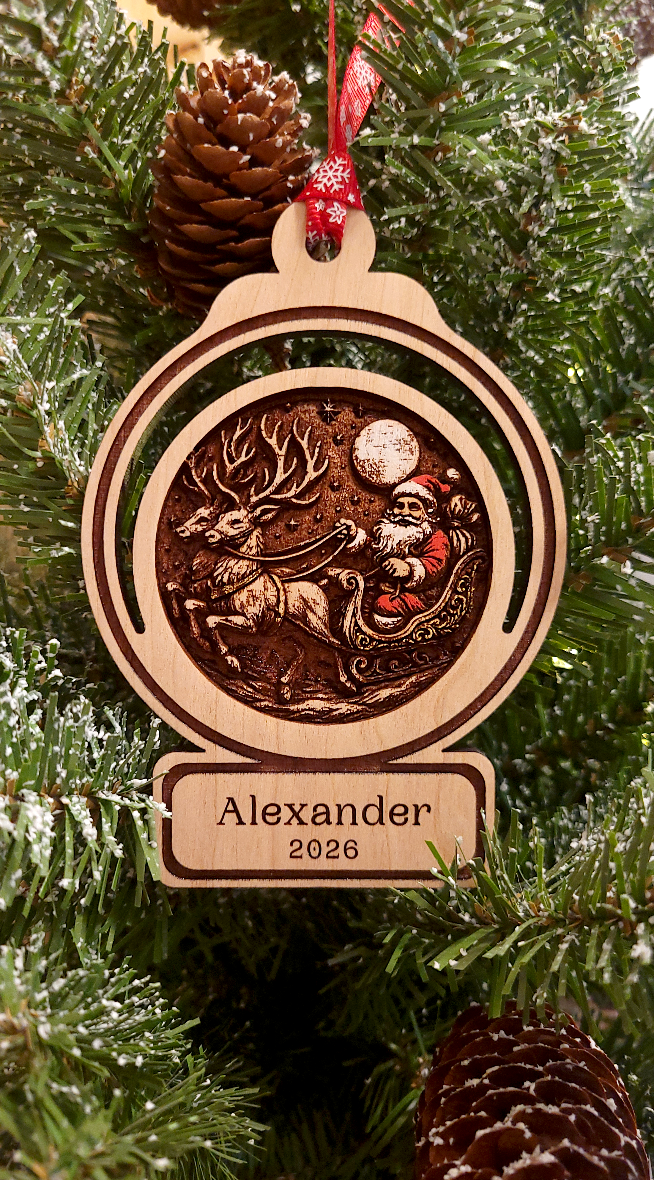Santa in sleigh with two reindeer.png