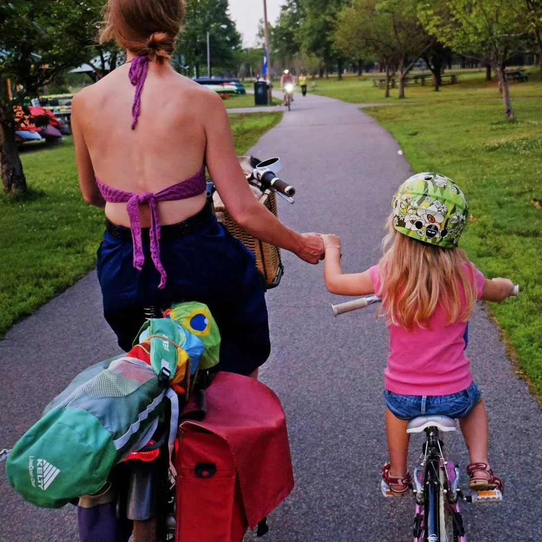 Bikabout-Megan-Ramey-holding-hands-with-daughter-biking.jpg