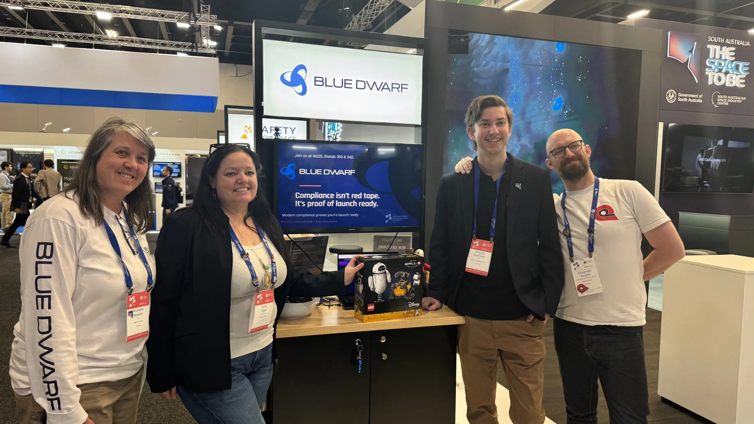 The Blue Dwarf team at their booth on the “South Australia – the Space to Be” stand at IAC 2025, Sydney