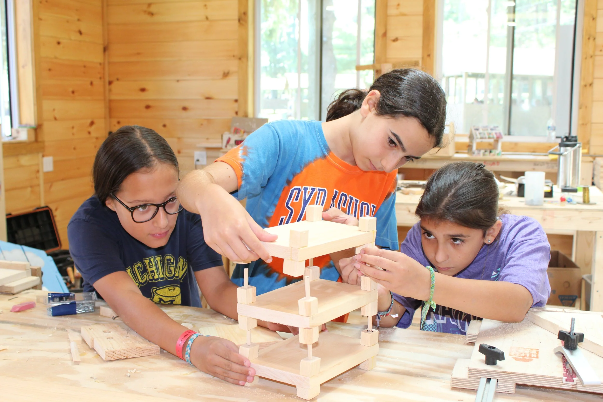 Ramah in the Poconos- Girls completing project.JPG