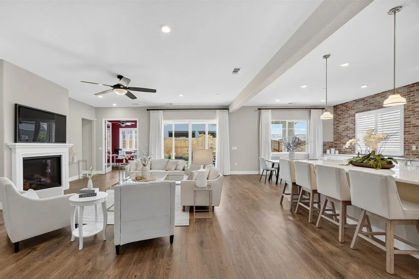 luxury great room, living room, kitchen, dining room, home office with sliding doors to the back yard in Lincoln California 