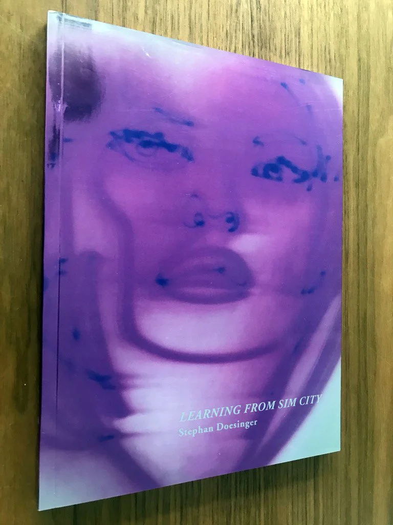 Book cover titled 'Learning From Sim City' by Stephan Doesinger featuring one of his lasergraphys published by Revolver Books