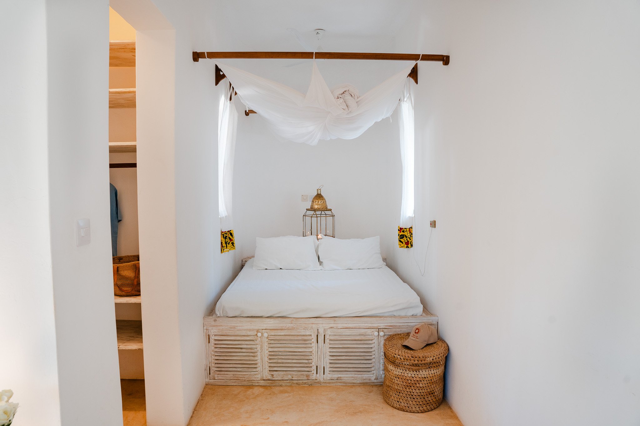 Downstairs bedroom featuring the second king-size bed, and closest leading to the en-suite bathroom.